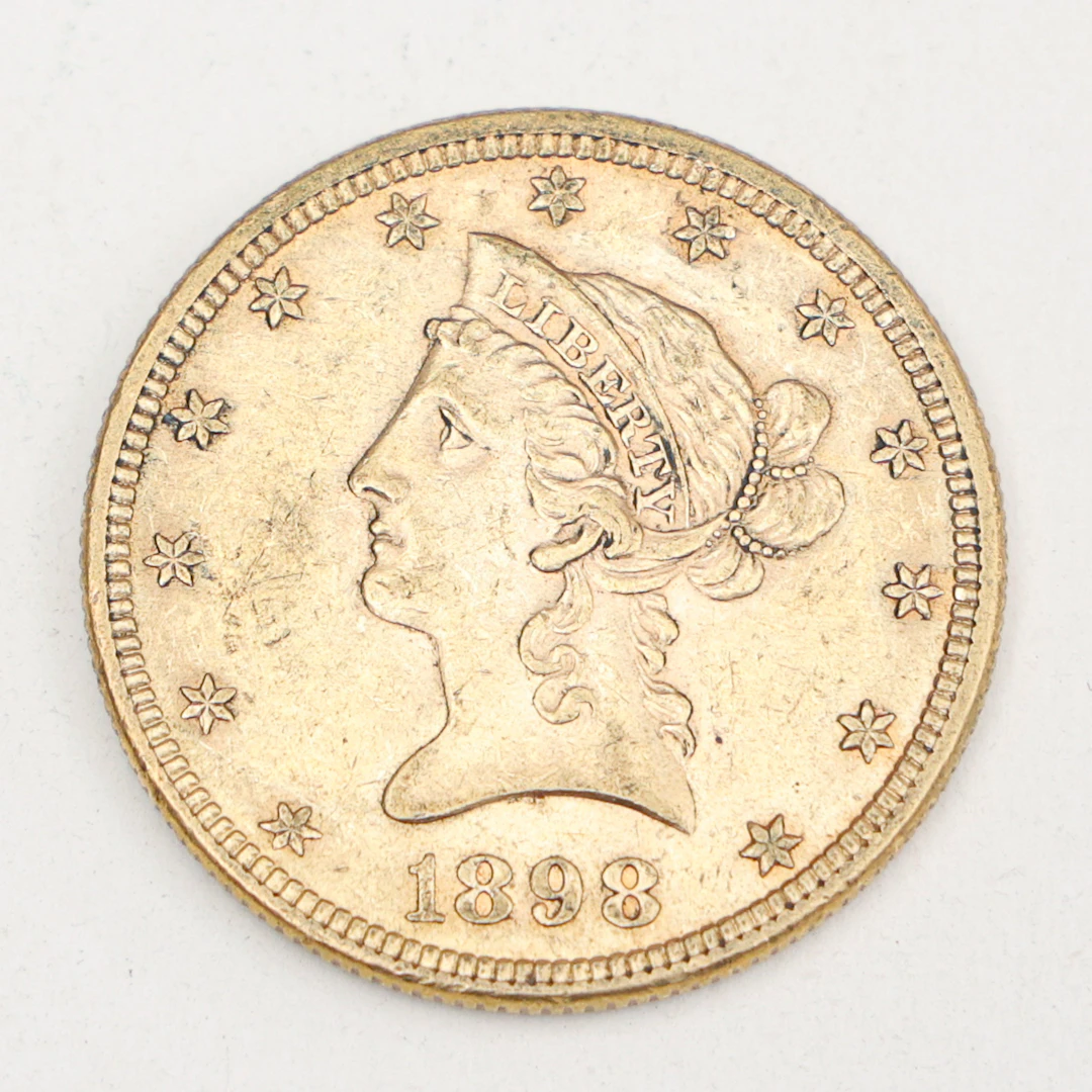 MYNT,21,6 karat guld, 10 dollar,"Liberty Head Eagle", 1898,vikt 16,8 gram.