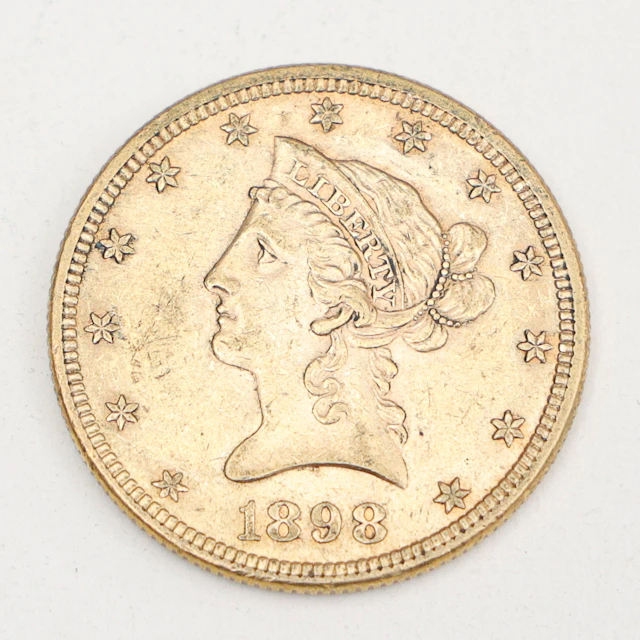 MYNT,21,6 karat guld, 10 dollar,"Liberty Head Eagle", 1898,vikt 16,8 gram.