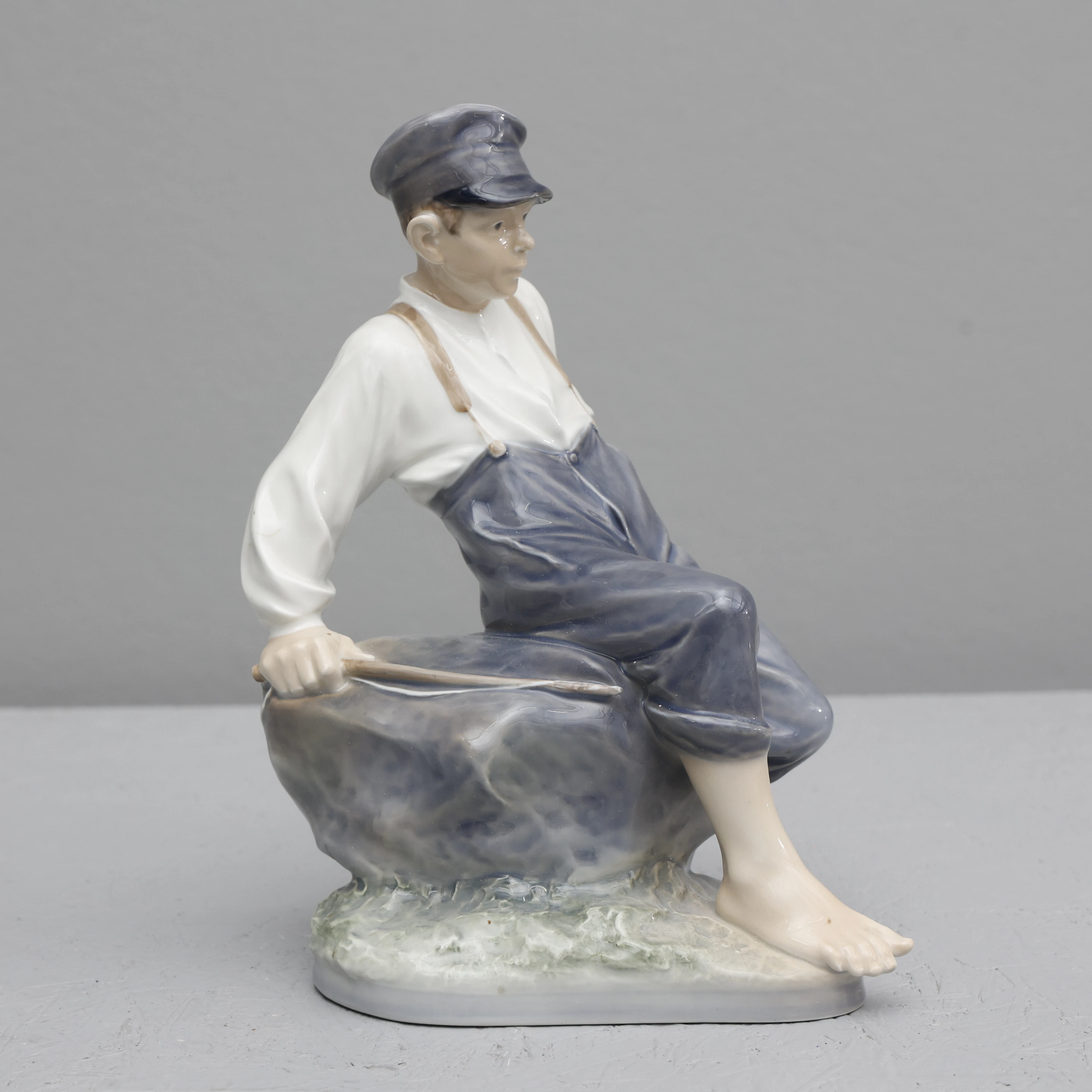 CHRISTIAN THOMSEN. ROYAL COPENHAGEN, FIGURIN, "BOY ON ROCK", KUNGLIG DANSK.