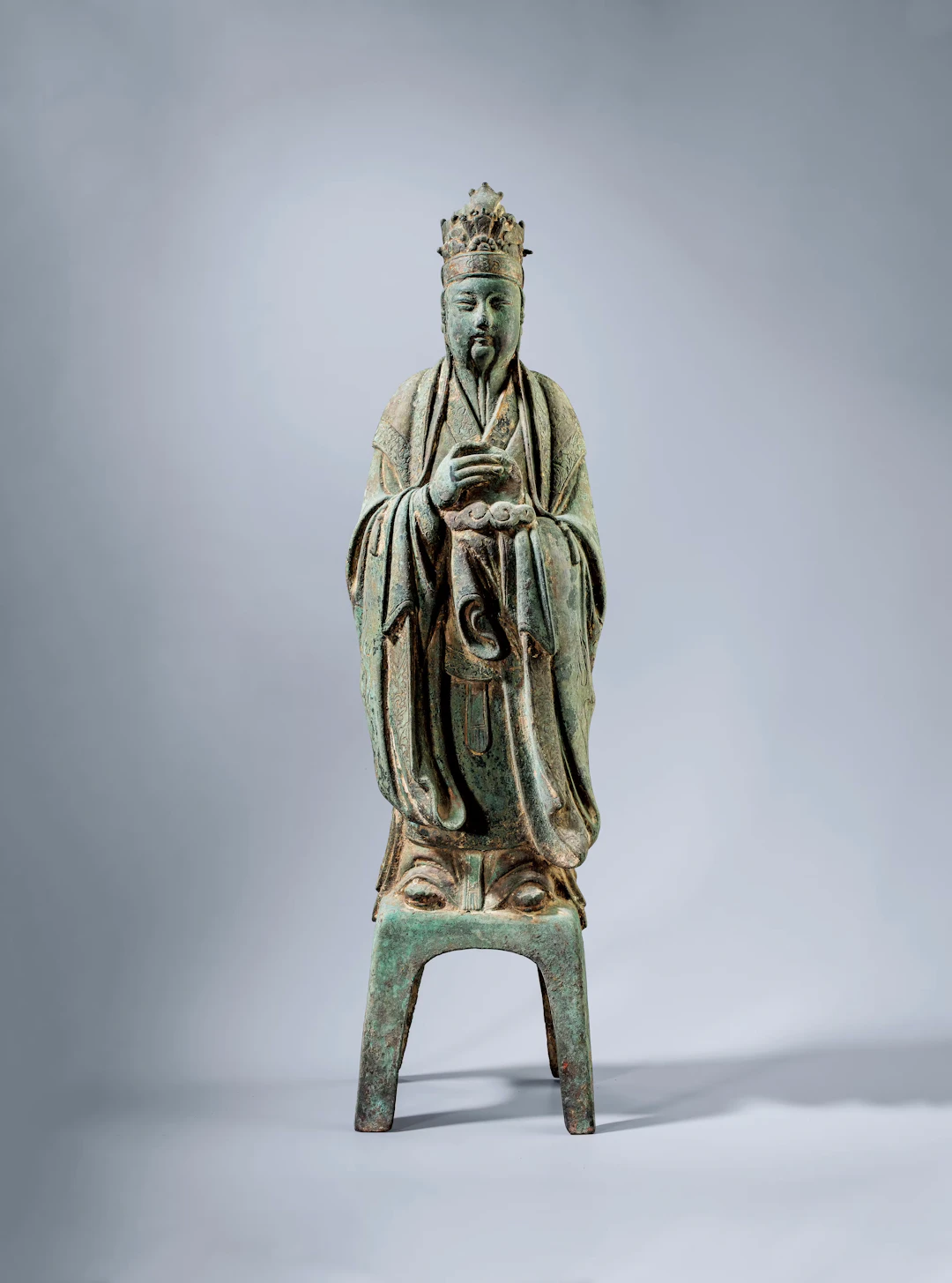 A BRONZE STANDING FIGURE OF A COURT OFFICIAL, MING DYNASTY, 14TH-17TH CENTURY