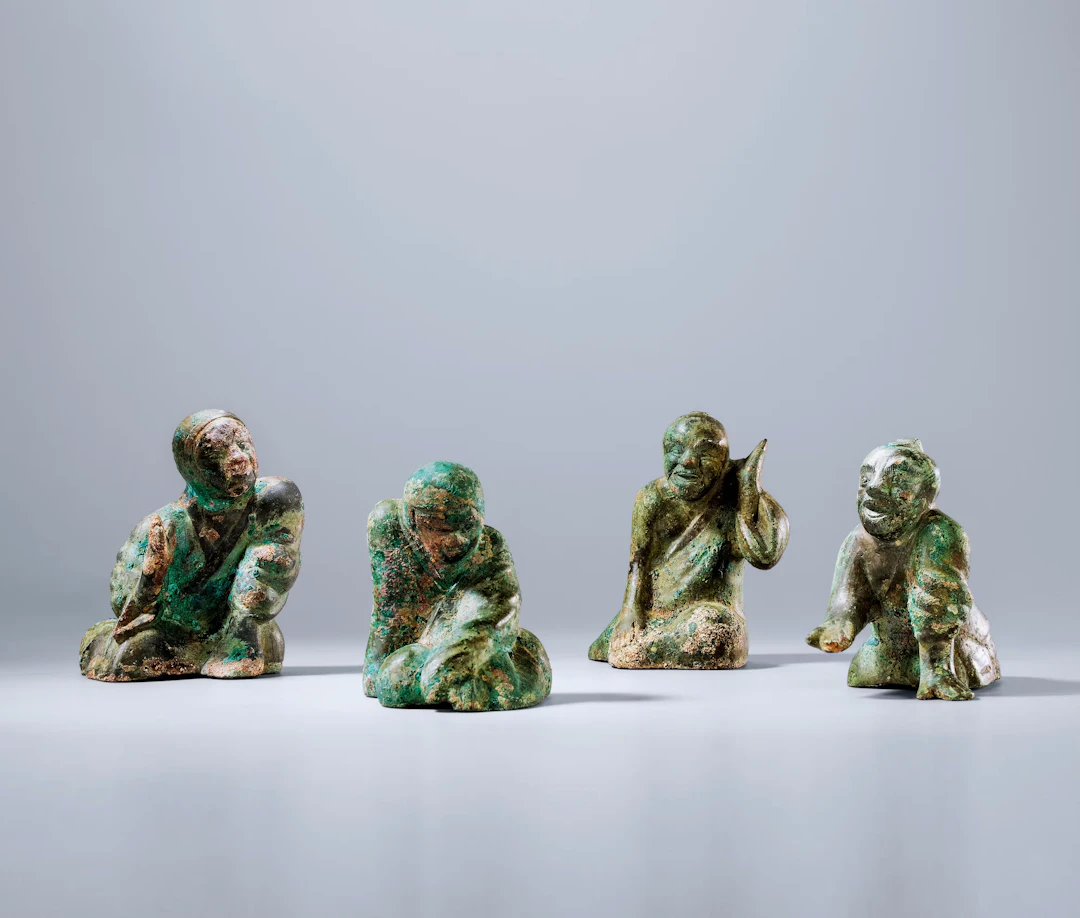 A GROUP OF FOUR ARCHAIC BRONZE 'FIGURAL' WEIGHTS, WESTERN HAN DYNASTY