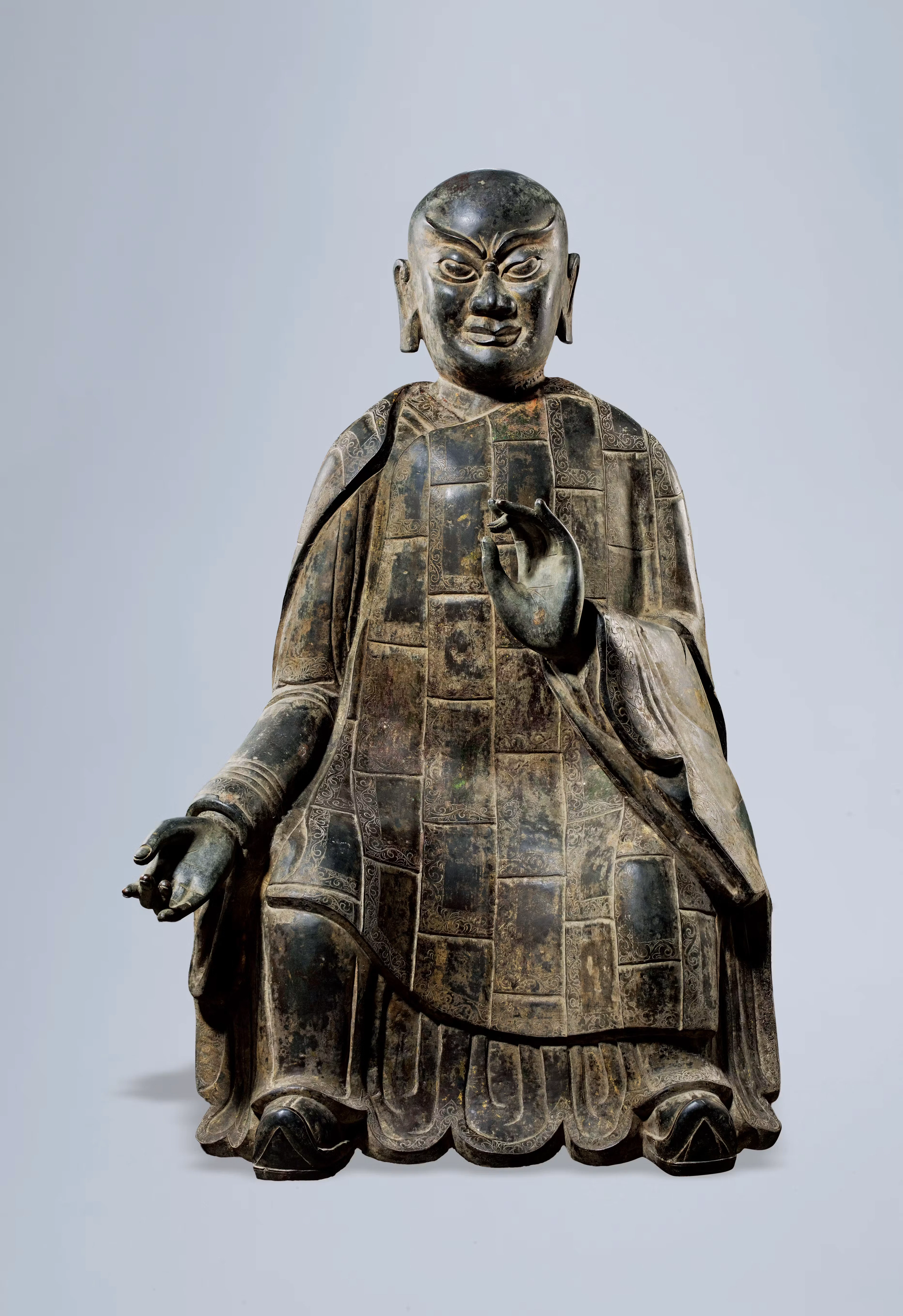A RARE AND LARGE BRONZE SEATED FIGURE OF A LUOHAN, SONG DYNASTY TO