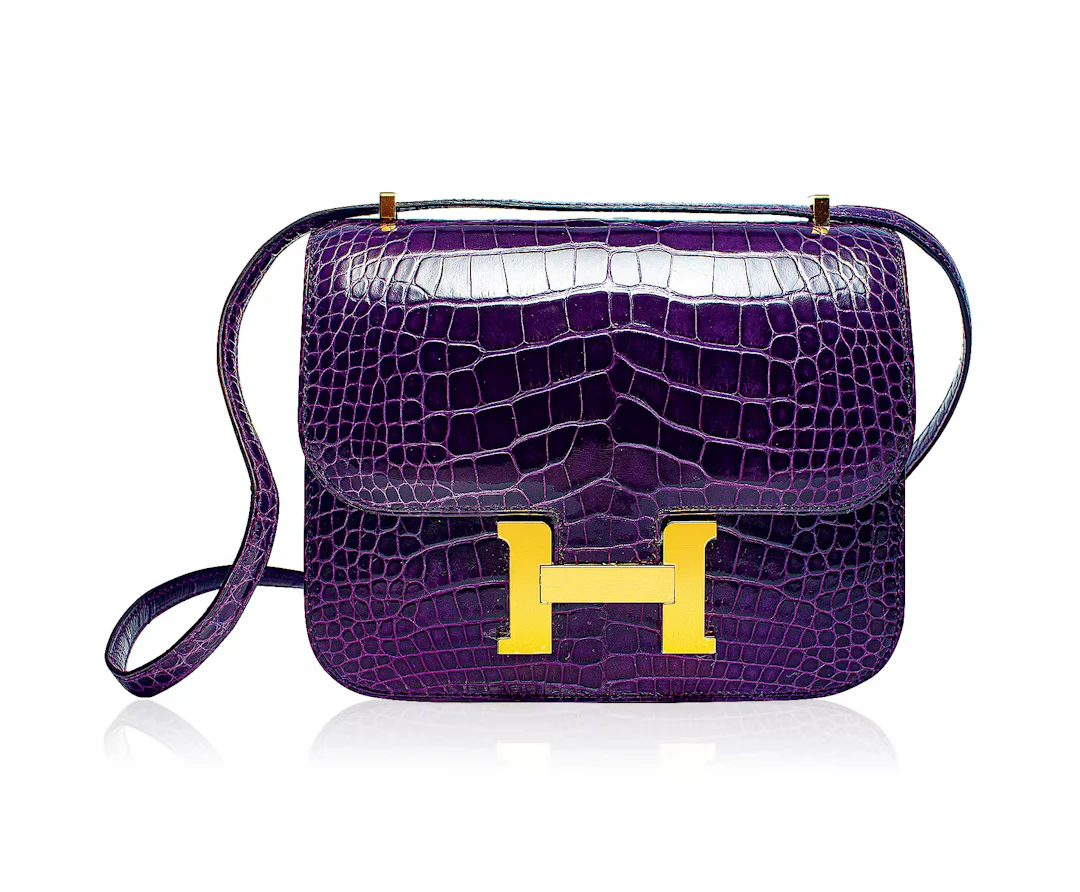A CASSIS SHINY ALLIGATOR MINI CONSTANCE 18 GOLD HARDWARE, 2022, BY HERMÈS