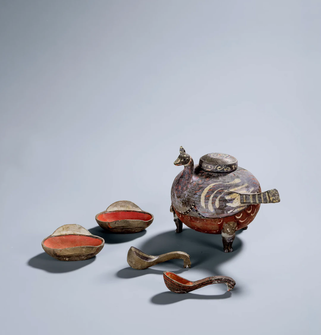 A SET OF PAINTED POTTERY WINE POT, EARED CUPS AND LADLES, WESTERN