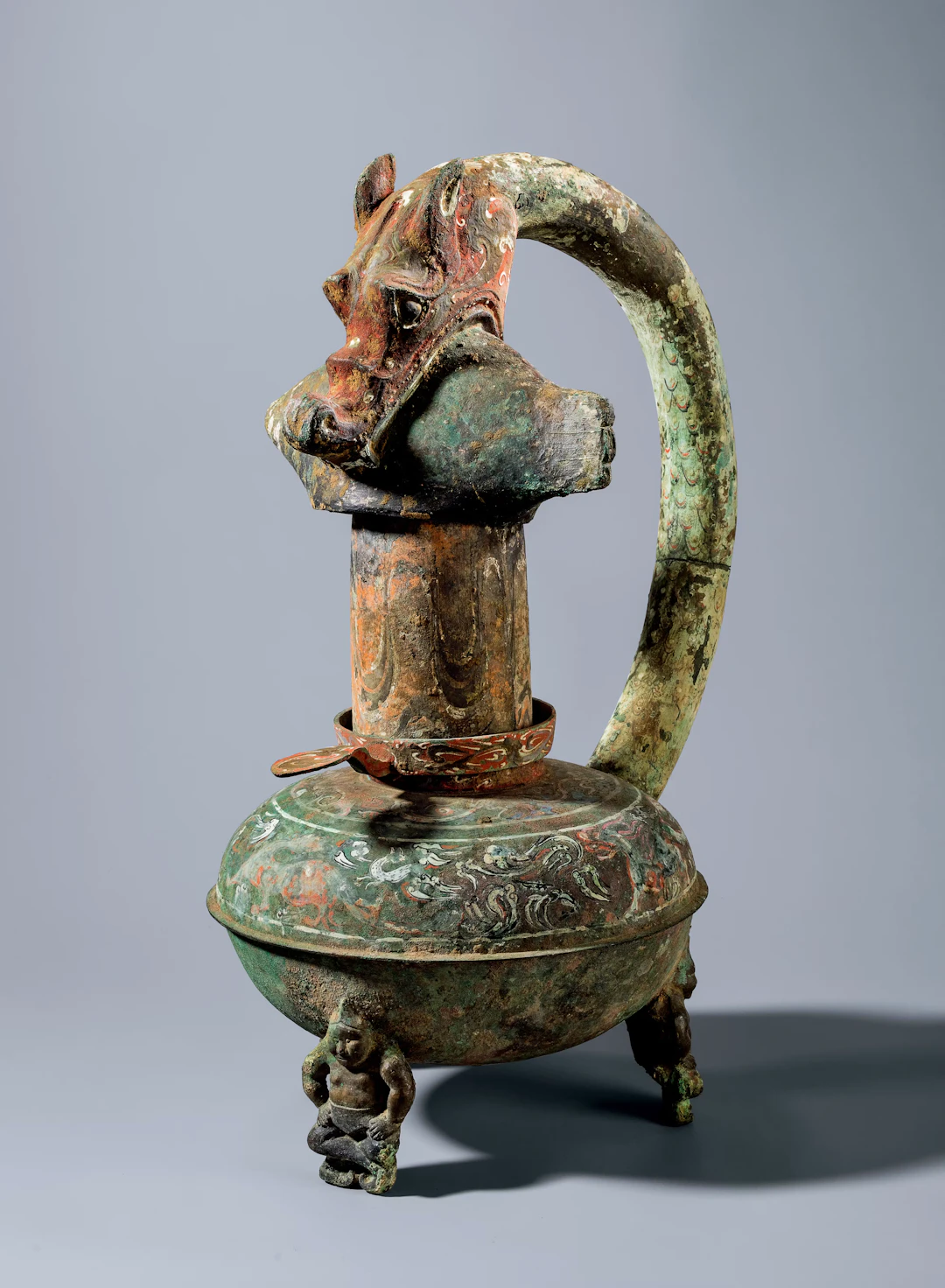 A PAINTED ARCHAIC BRONZE 'DRAGON AND FISH' LAMP, WESTERN HAN DYNASTY