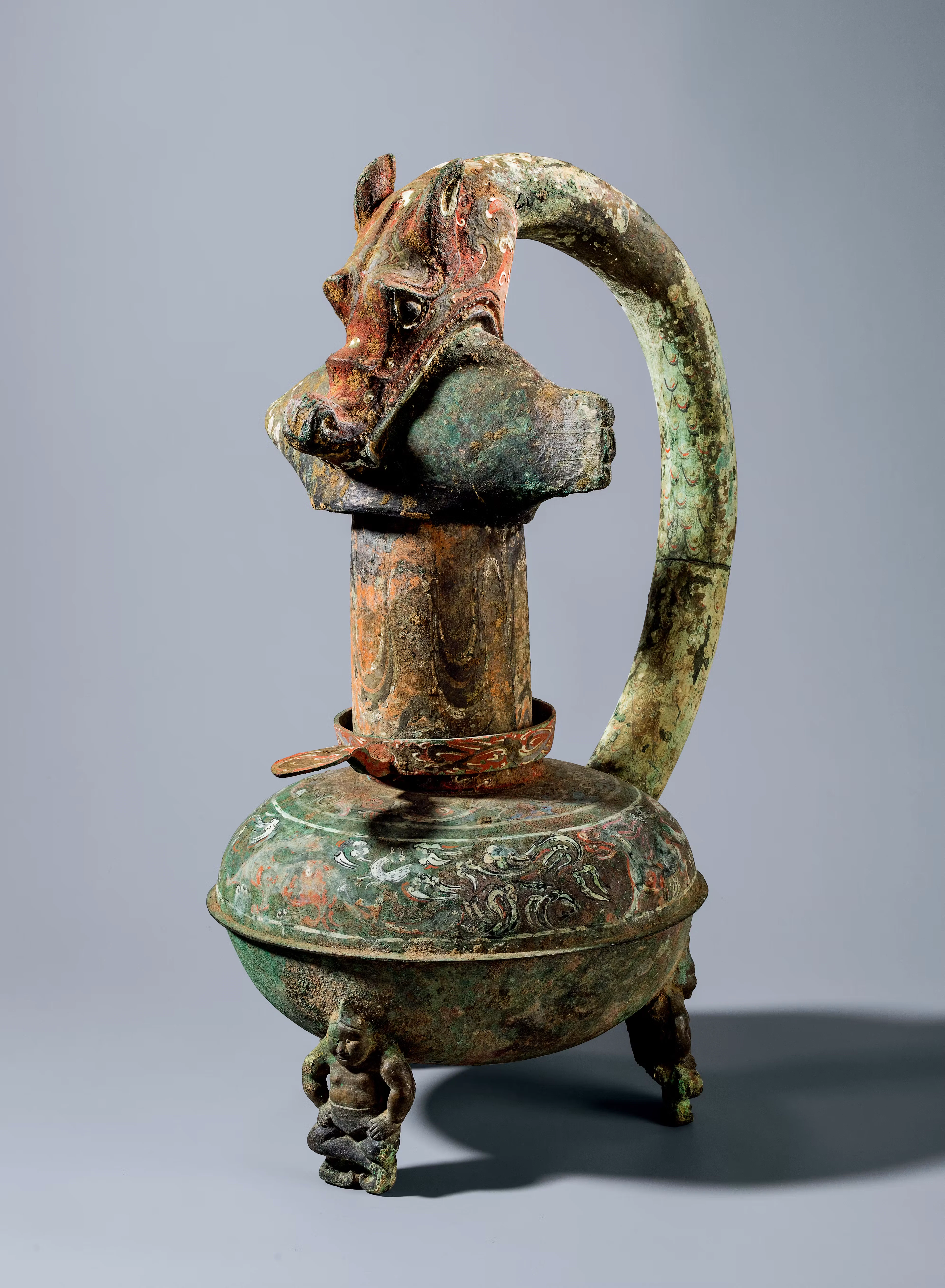 A PAINTED ARCHAIC BRONZE 'DRAGON AND FISH' LAMP, WESTERN HAN DYNASTY