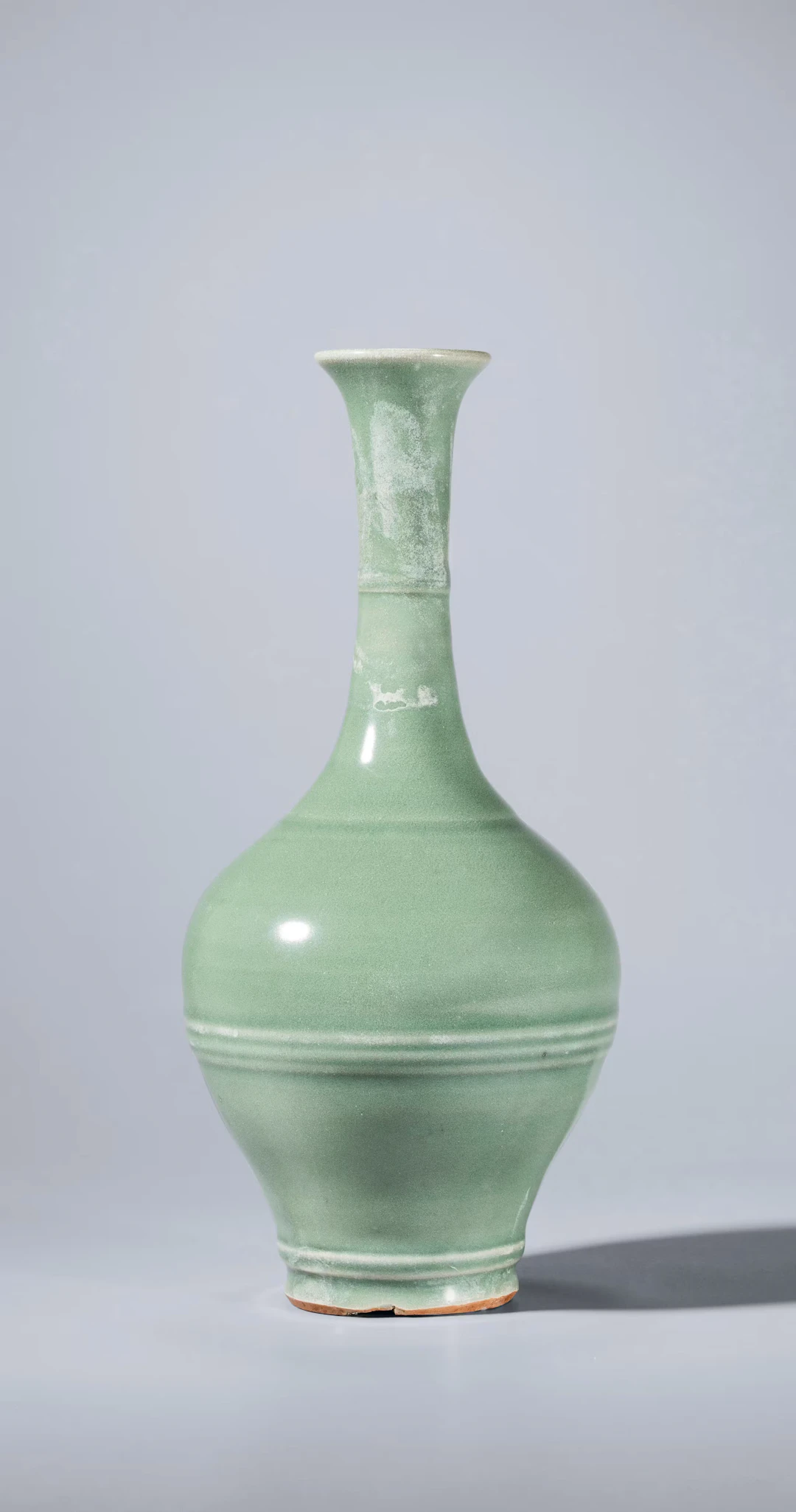 A LONGQUAN CELADON RIBBED VASE, YUAN DYNASTY TO EARLY MING DYNASTY