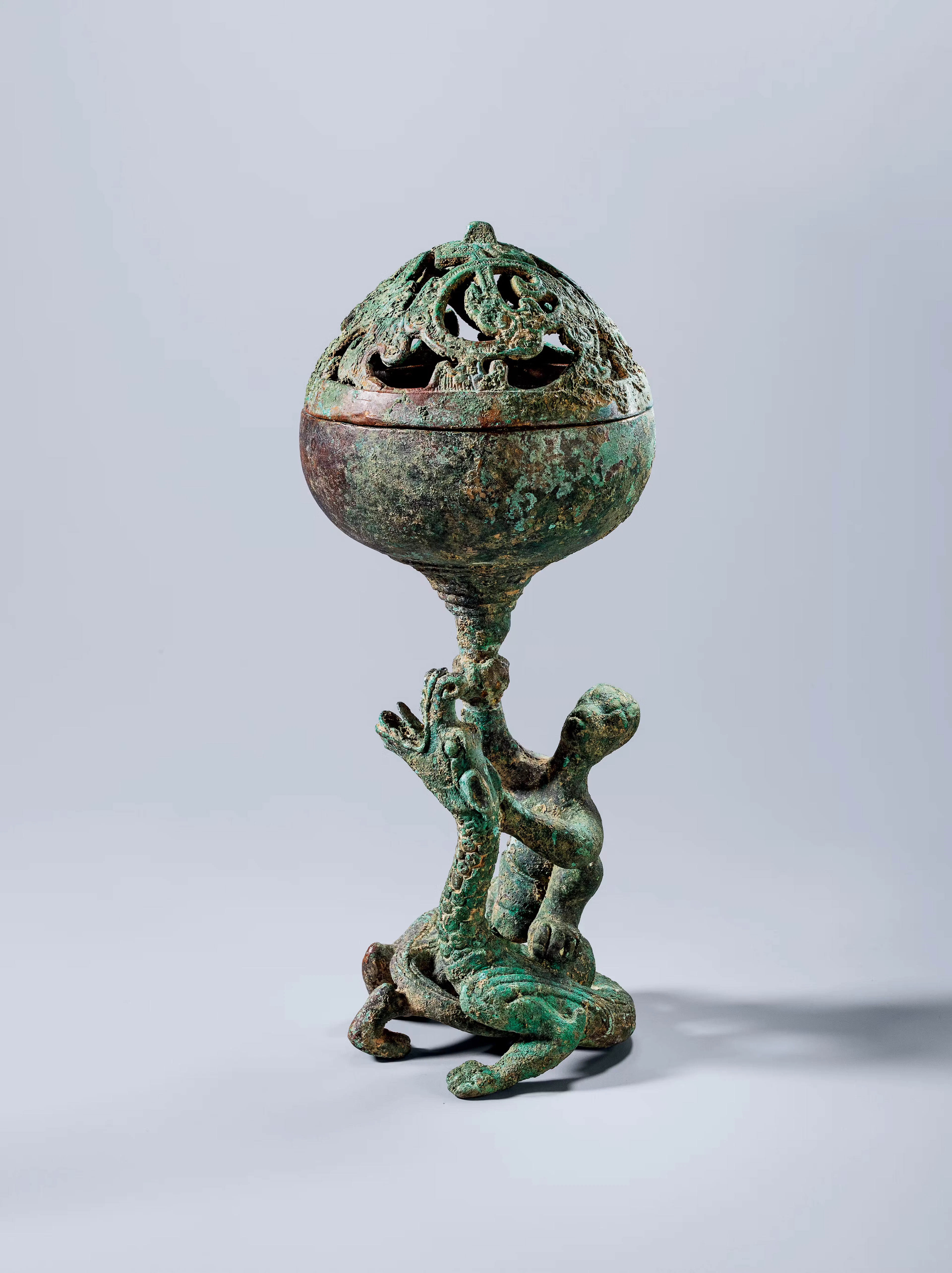 AN ARCHAIC BRONZE 'DRAGON AND RIDER' INCENSE BURNER, HAN DYNASTY, 246 B.C.- 220