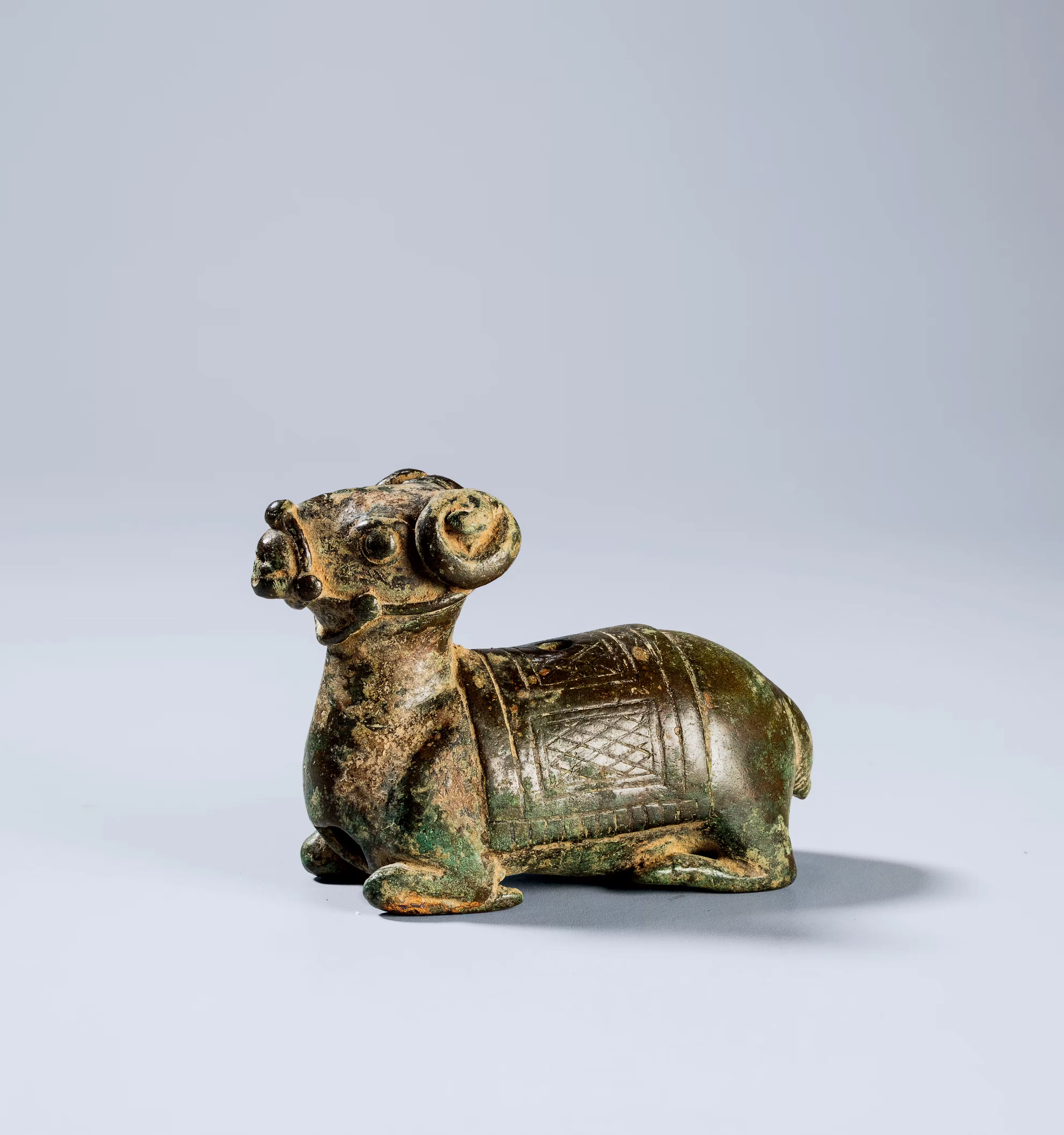 A BRONZE 'RAM' WATER DROPPER, HAN DYNASTY, 246 B.C.- 220