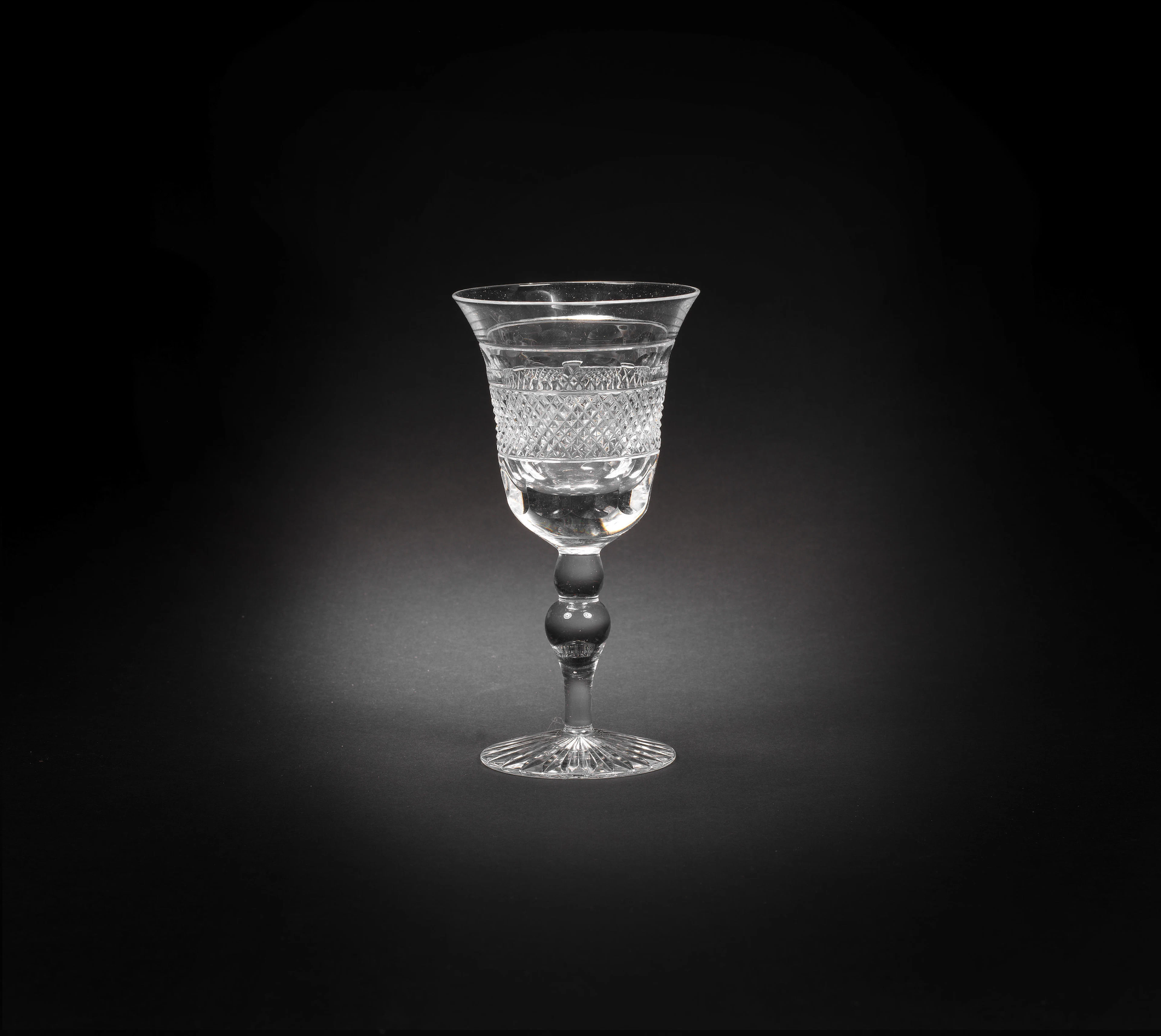 Sixteen cut-glass white wine glasses Made by Cumbria Crystal in the