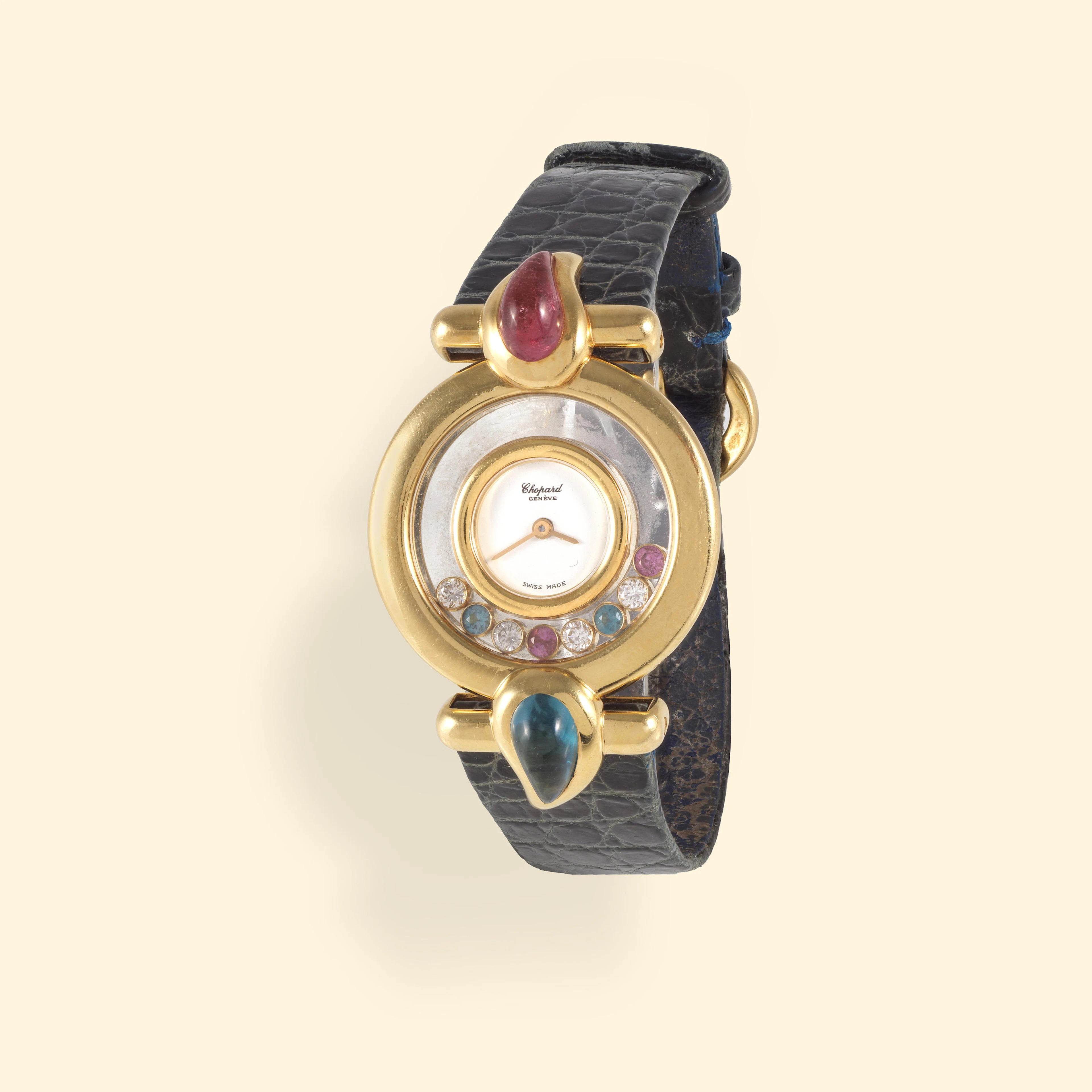 Chopard. A lady's 18K gold quartz wristwatch with topaze and tourmaline