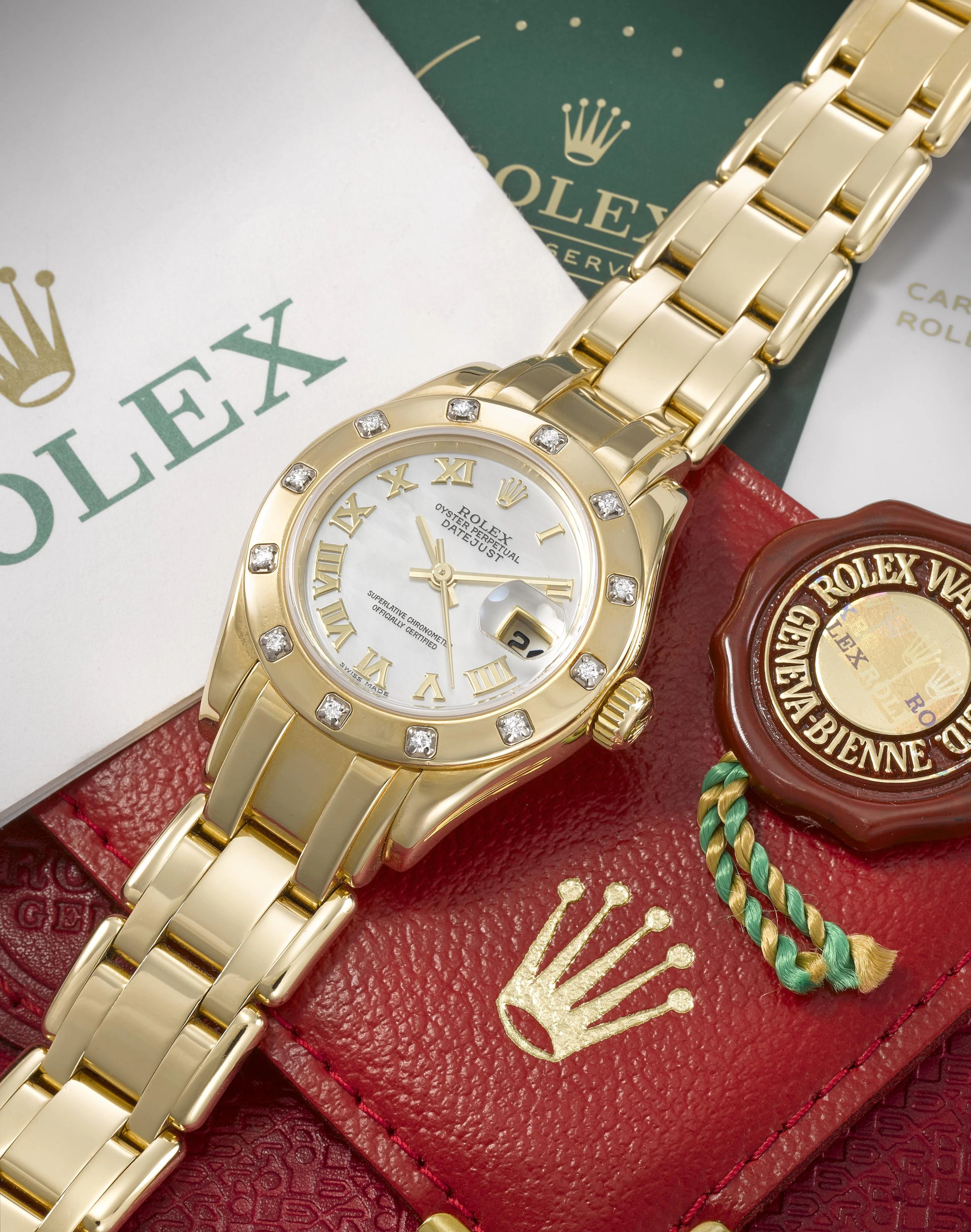 Rolex. A lady's 18K gold and diamond set automatic calendar bracelet
