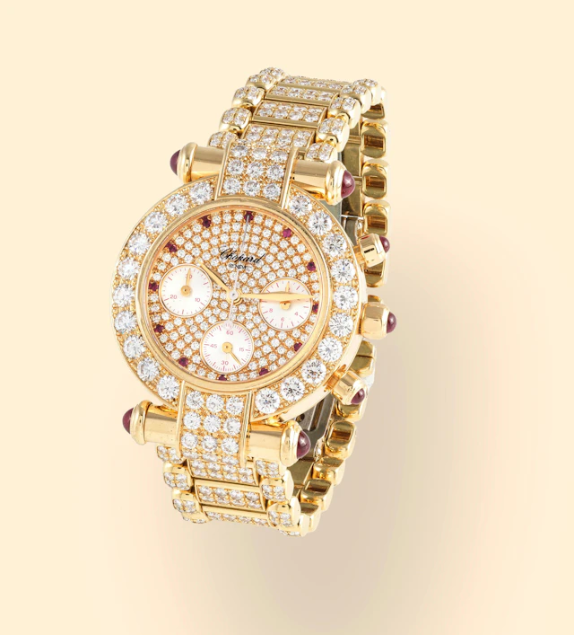 Chopard. An 18K gold quartz chronograph bracelet watch with diamonds