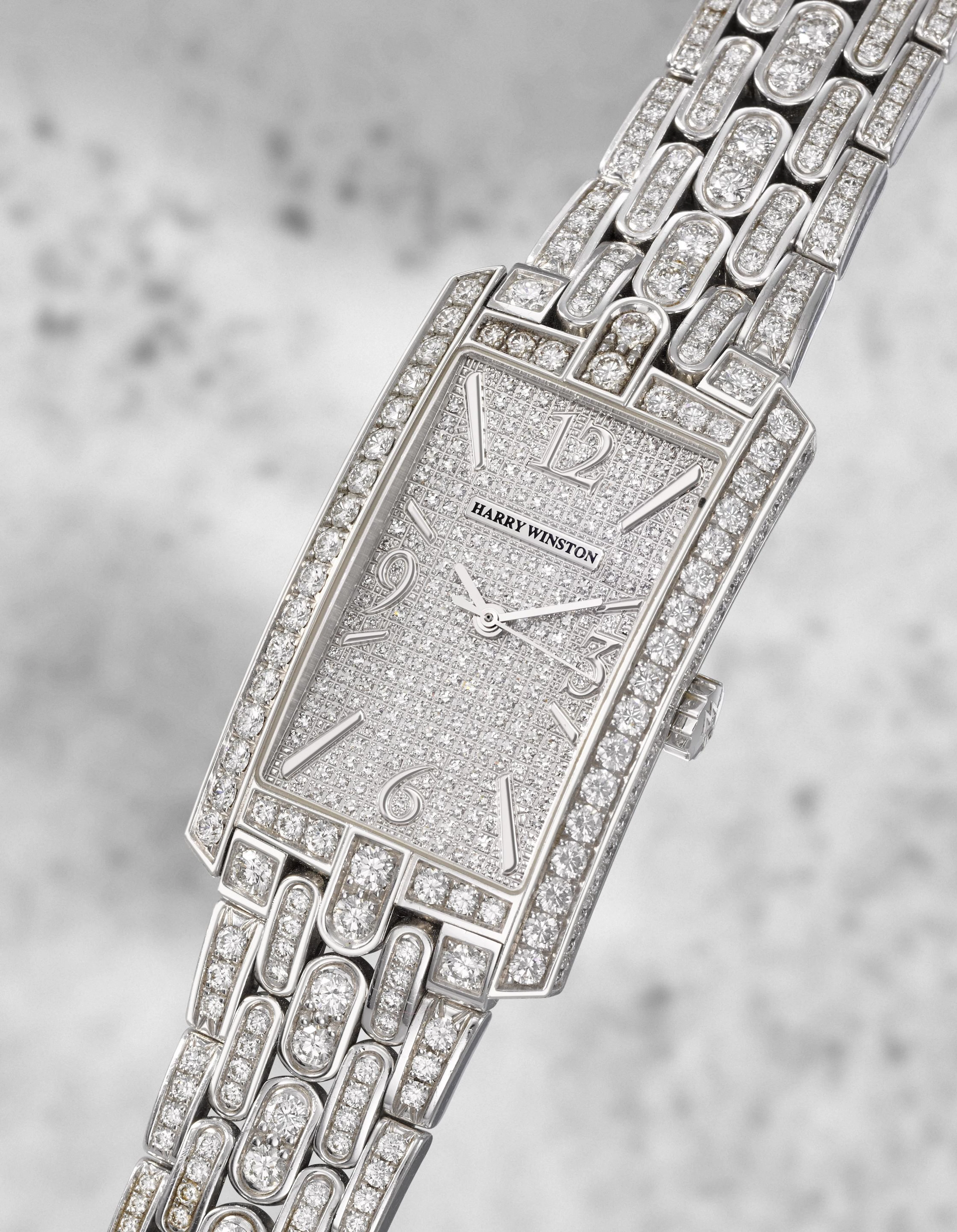 Harry Winston. A fine 18K white gold diamond set quartz bracelet watch