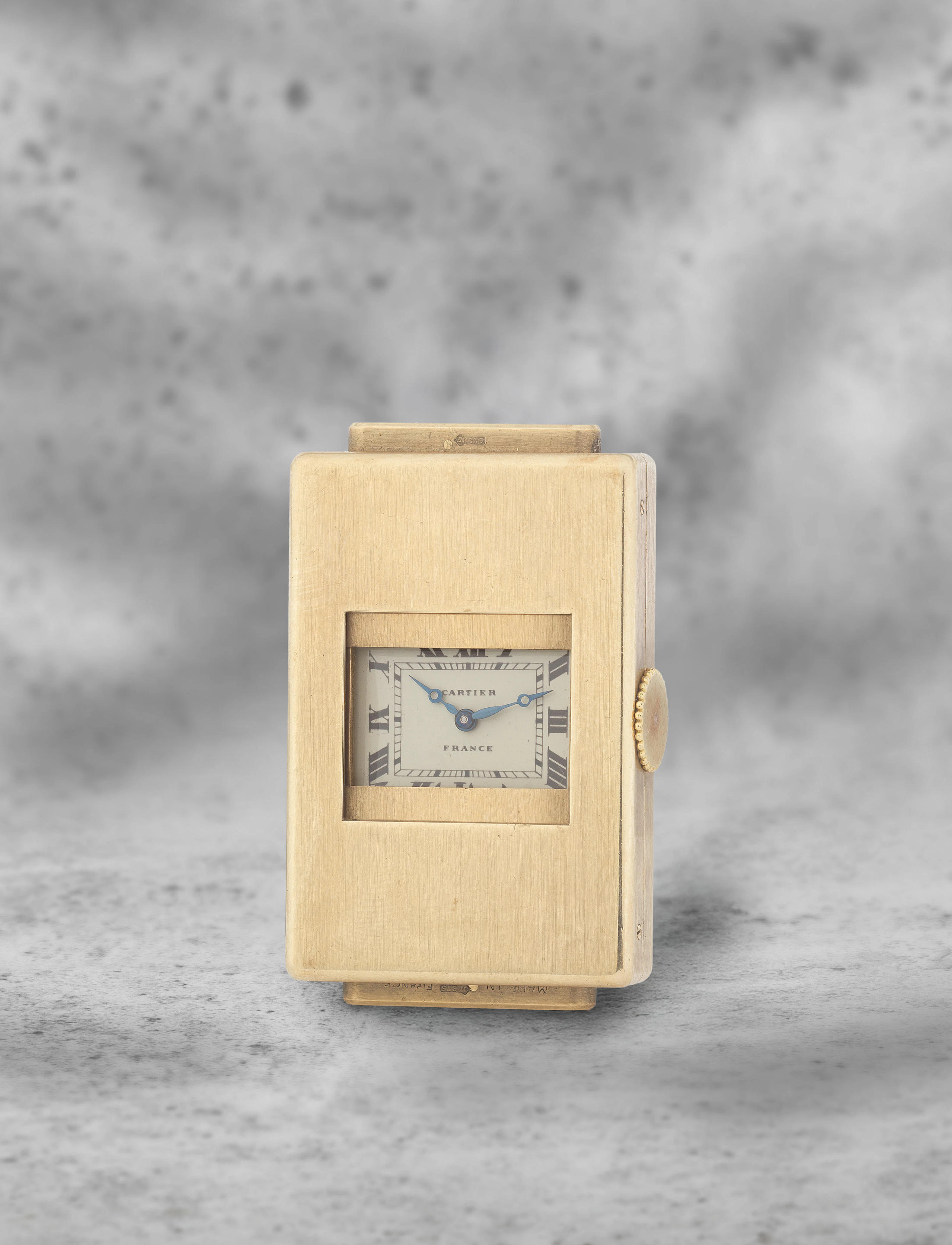 Cartier. A fine and rare 9K gold manual wind 'guillotine' shutter