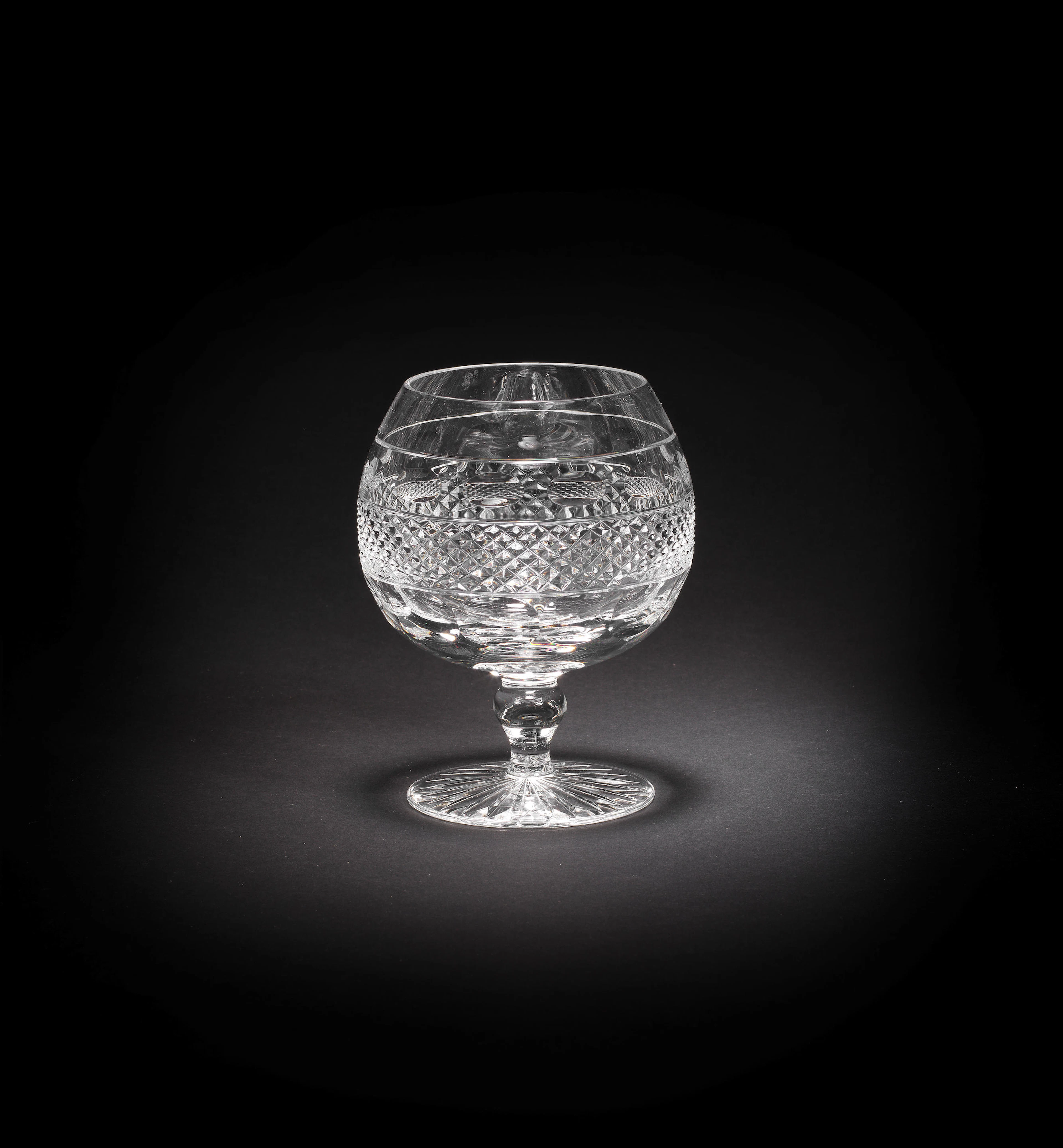 Twelve cut-glass brandy glasses Made by Cumbria Crystal in the Grasmere