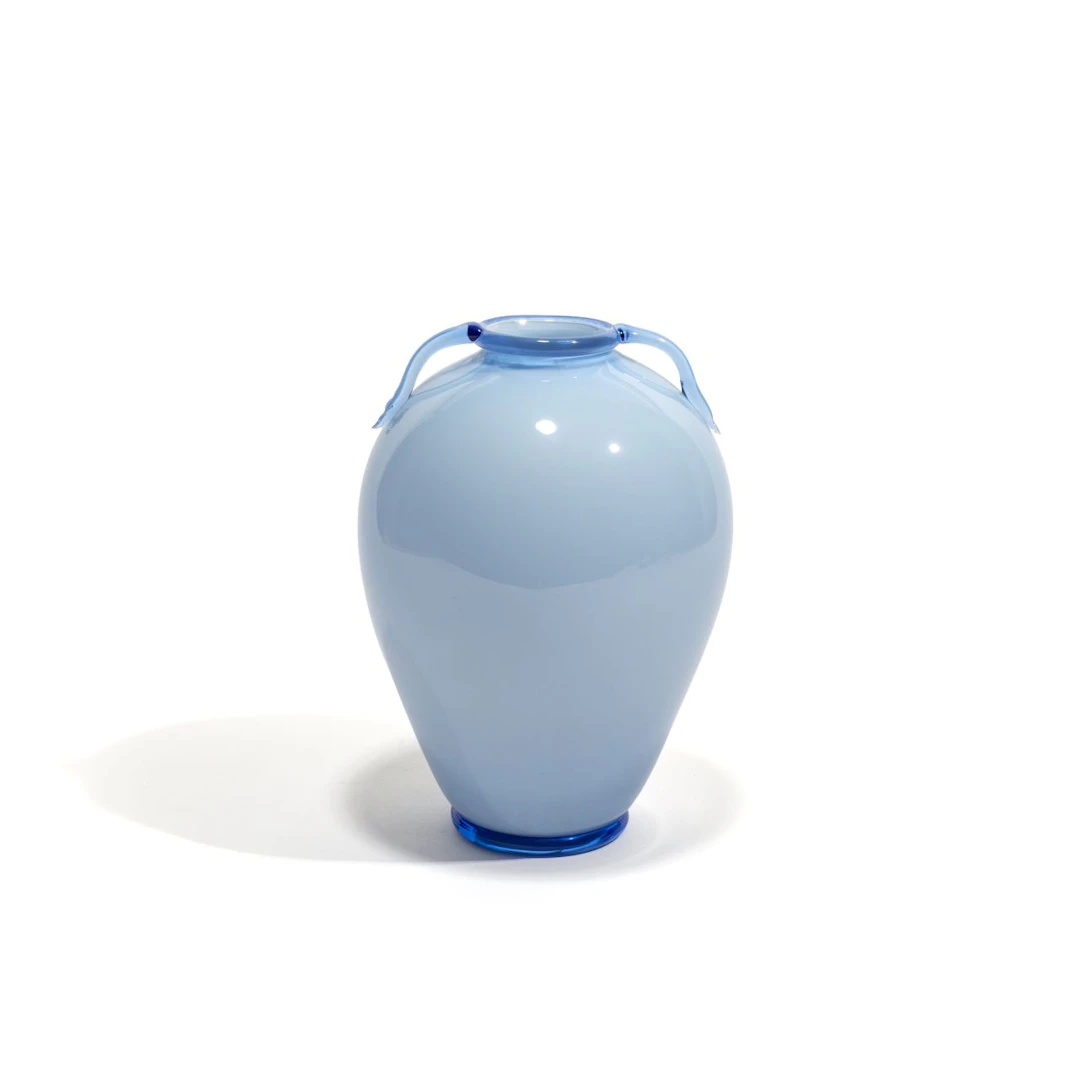 FRATELLI TOSO, 1925 ca. Un vaso in vetro opalino azzurro con ansette.