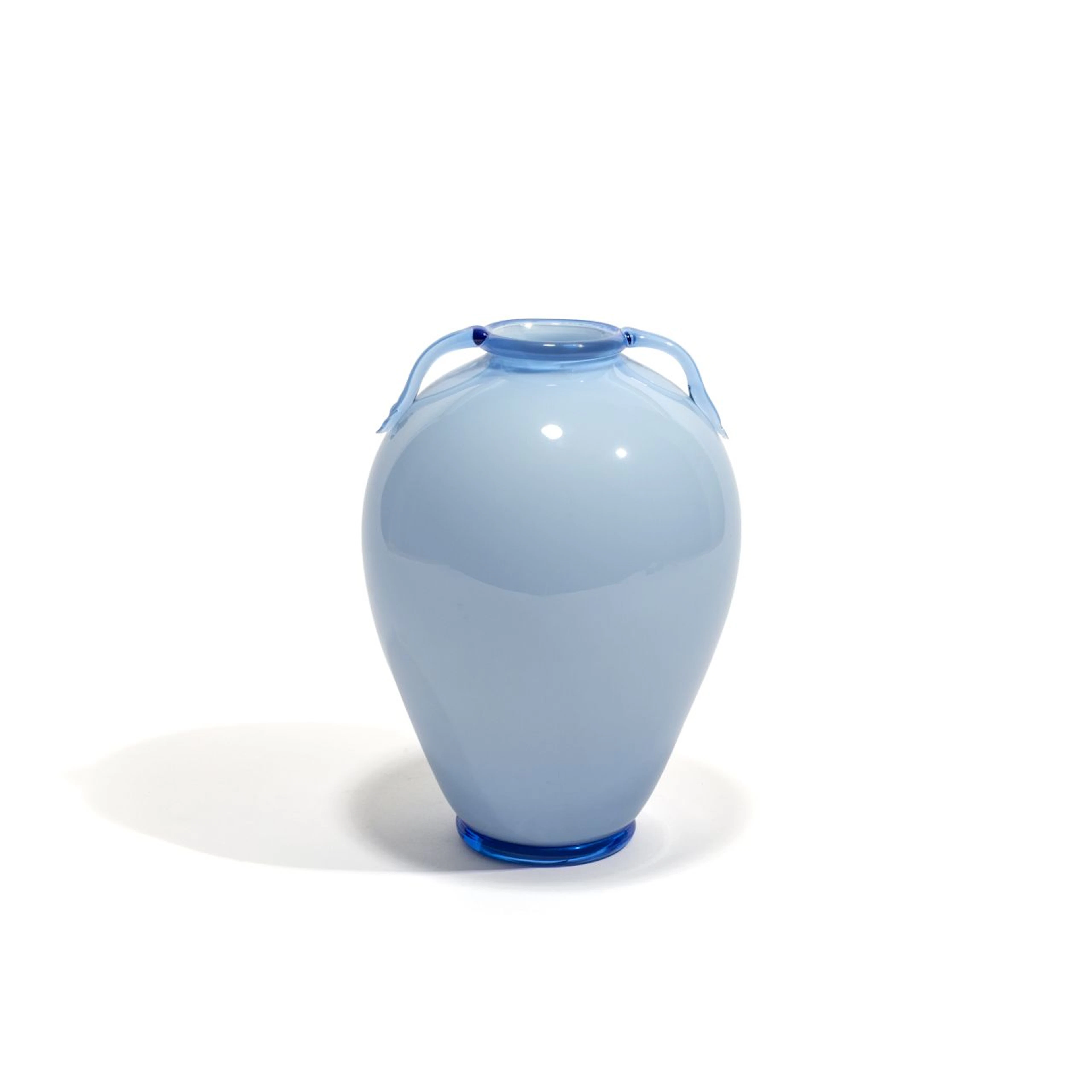 FRATELLI TOSO, 1925 ca. Un vaso in vetro opalino azzurro con ansette.