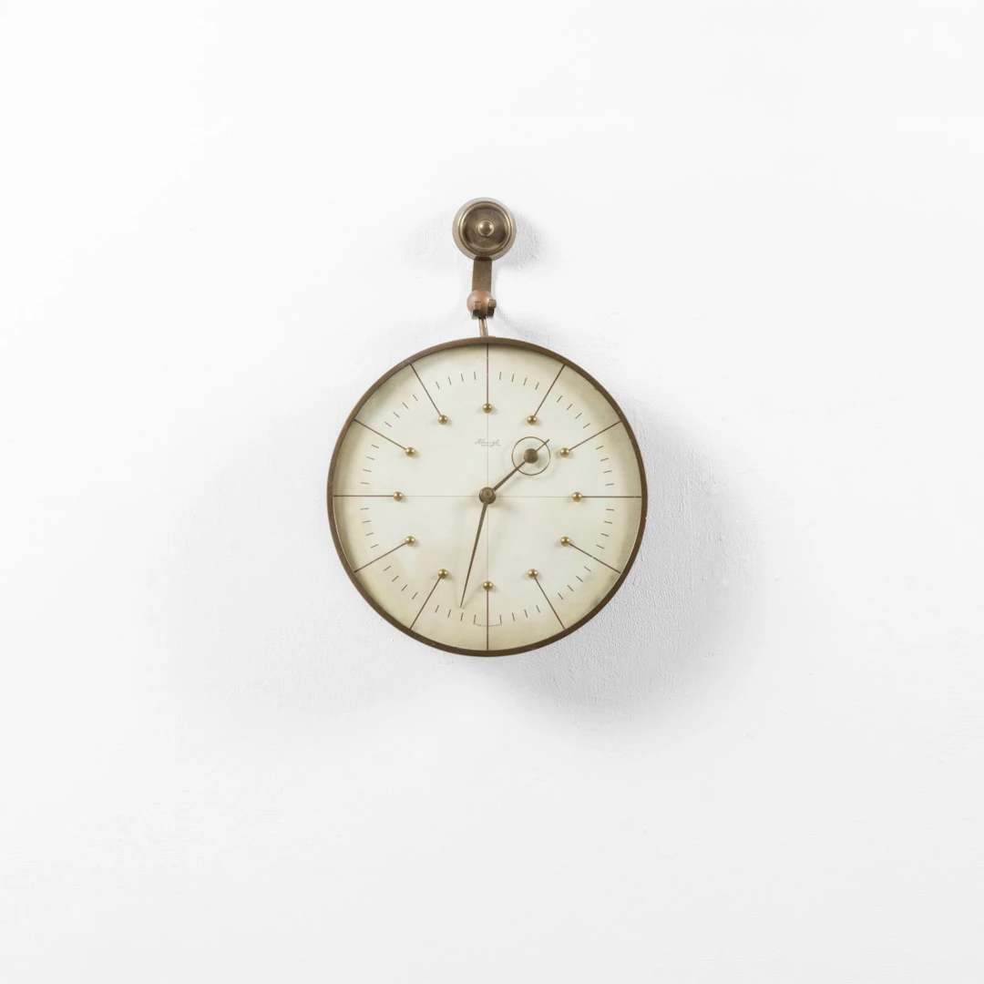 HEINRICH MOLLER, KIENZLE, anni '30. Un orologio da parete. Ottone