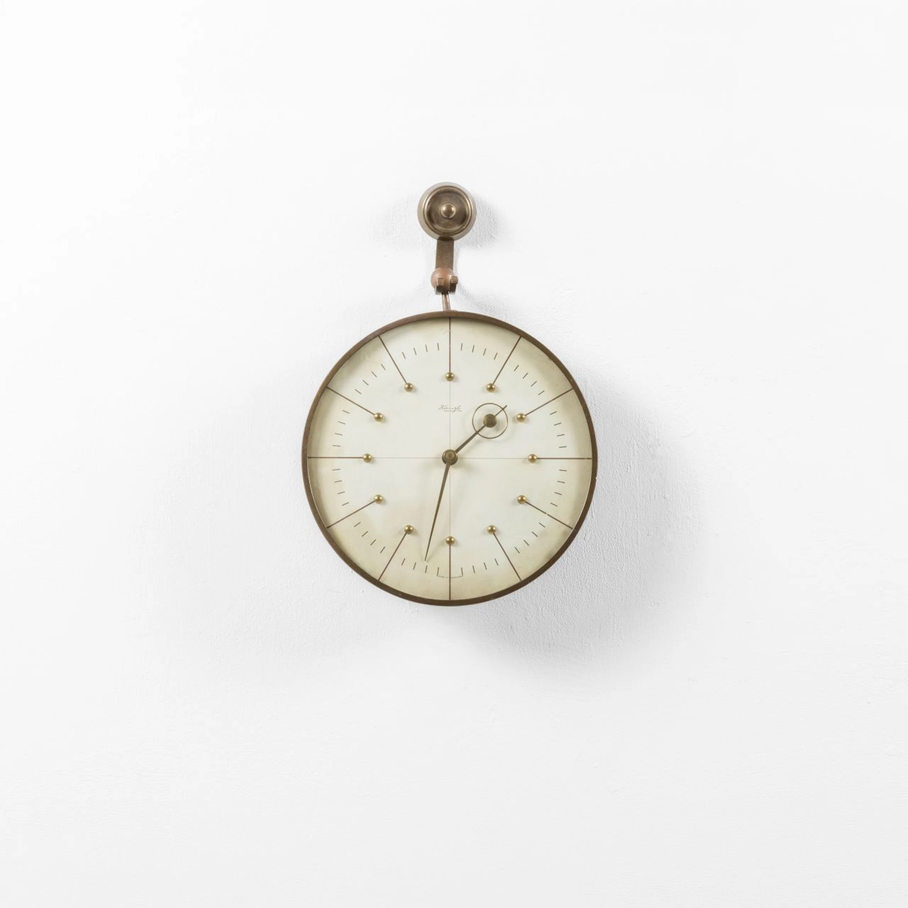 HEINRICH MOLLER, KIENZLE, anni '30. Un orologio da parete. Ottone