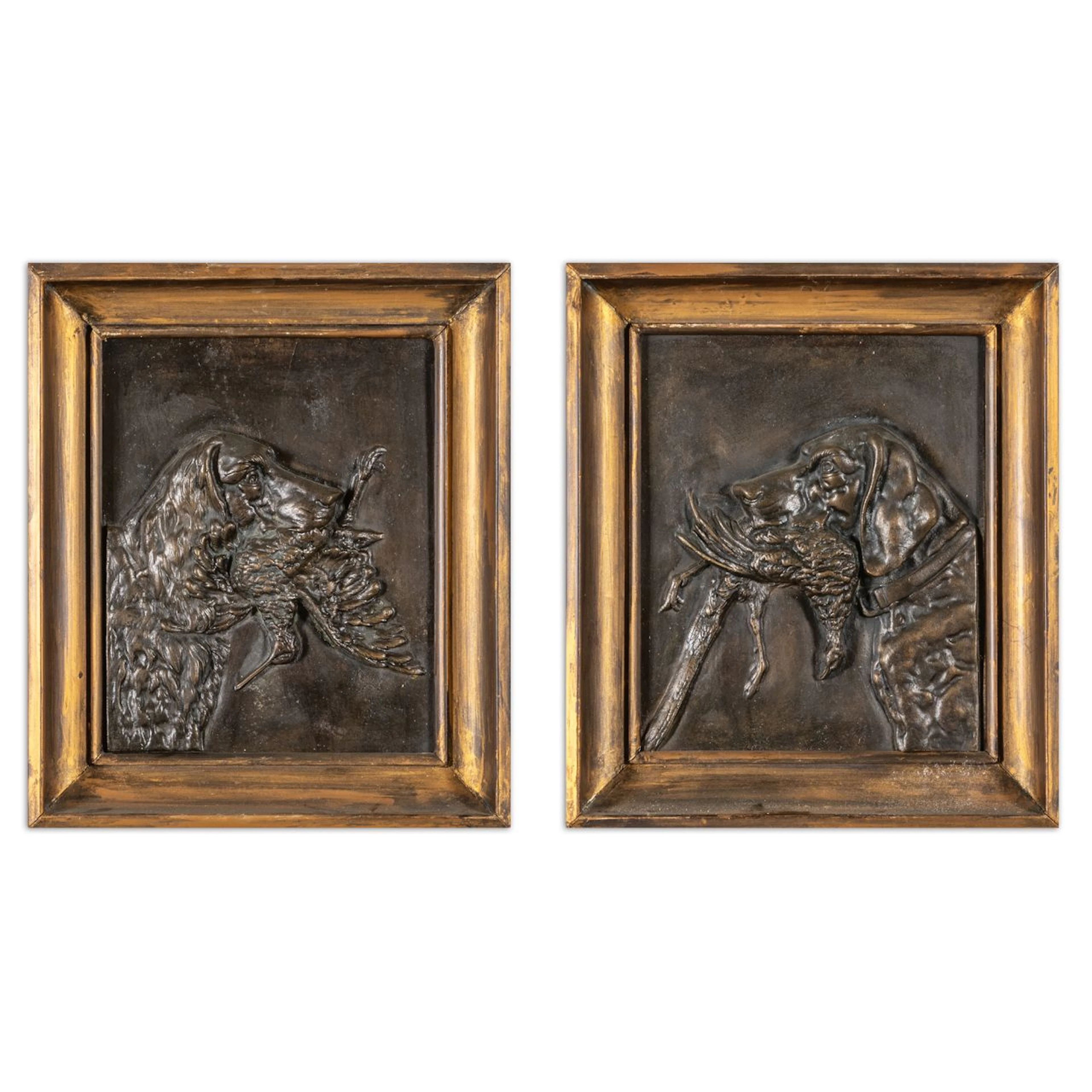 Due bassorilievi in bronzo raffiguranti cani con preda cm.24x29