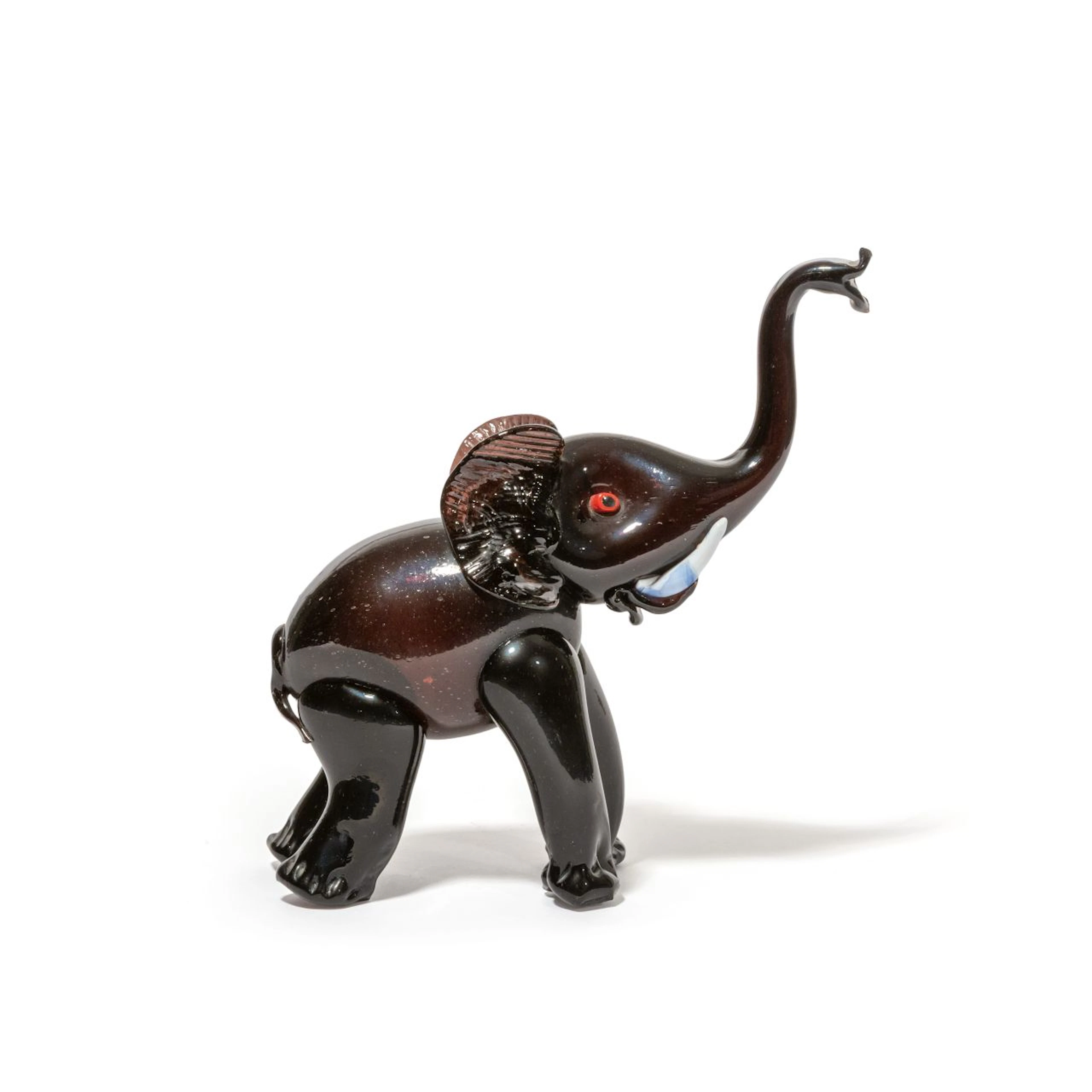 VETRERIA BAROVIER, 1930 ca. Un elefante in vetro ametista scuro. Lievi
