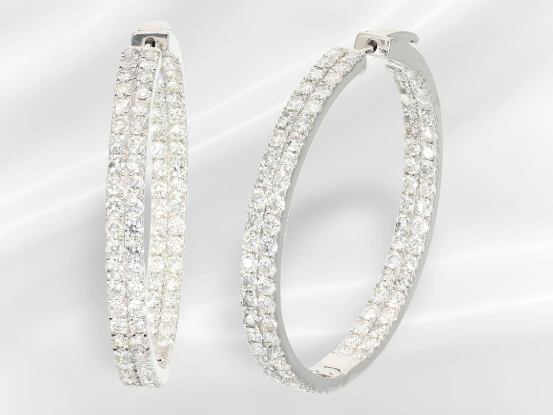Earrings: modern, large and very decorative hoop earrings with elaborate