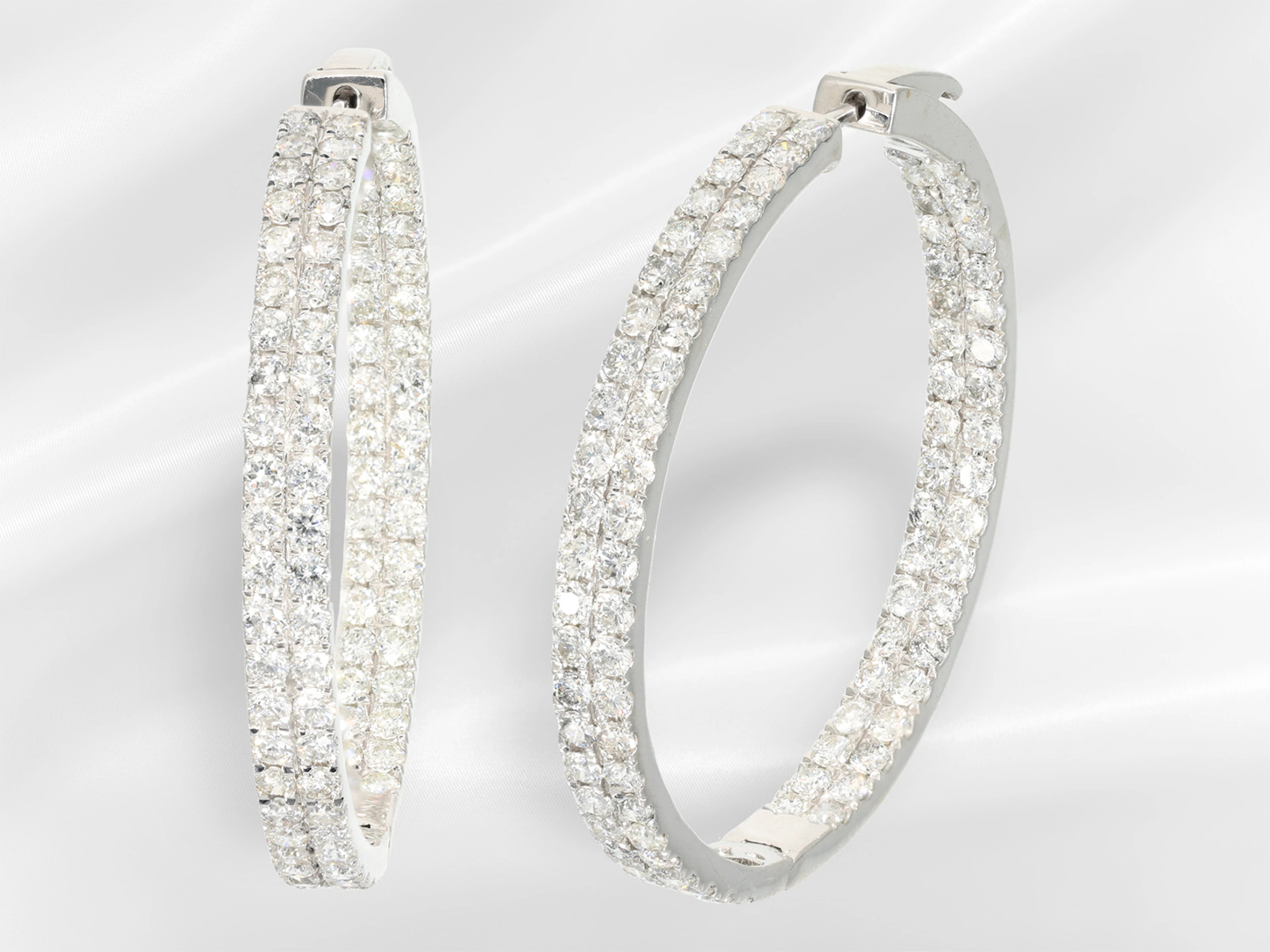 Earrings: modern, large and very decorative hoop earrings with elaborate