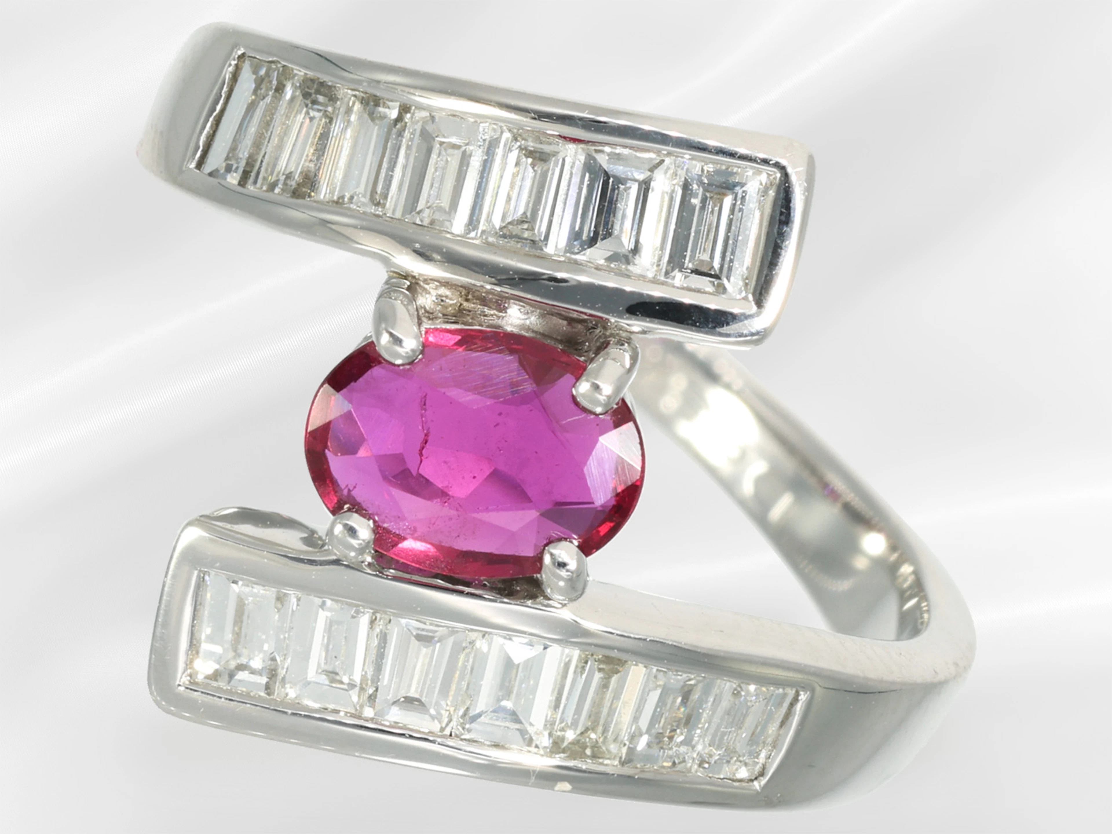 Ring: modern platinum ring with a ruby and baguette-cut diamonds