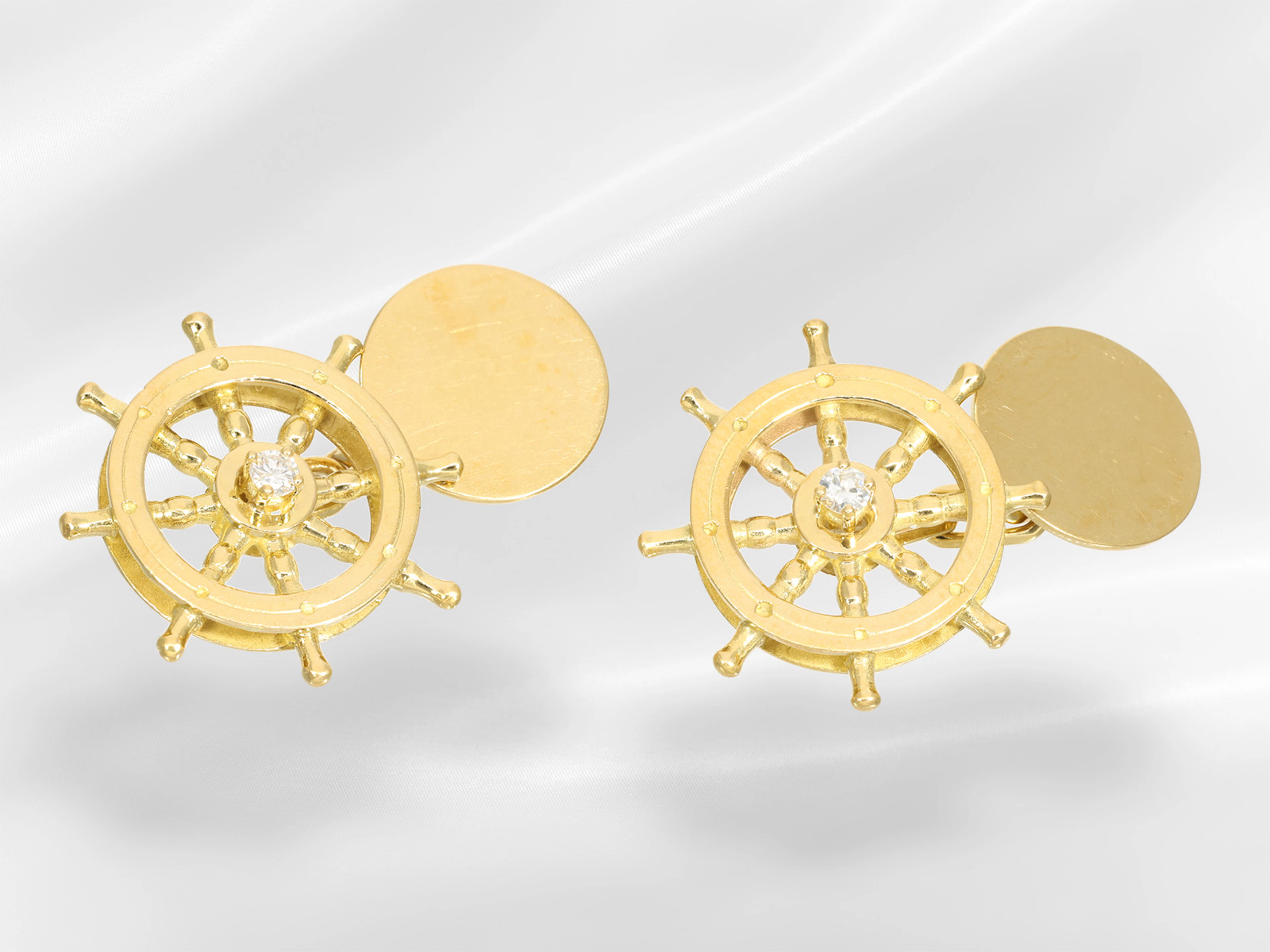 Gold cufflinks with ‘steering wheel’ scene and brilliant-cut diamonds