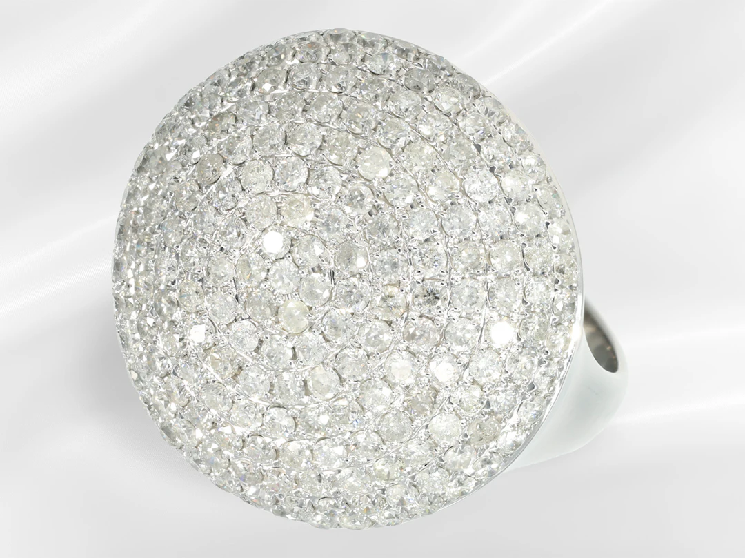 Ring: a white gold brilliant-cut diamond cocktail ring in as good