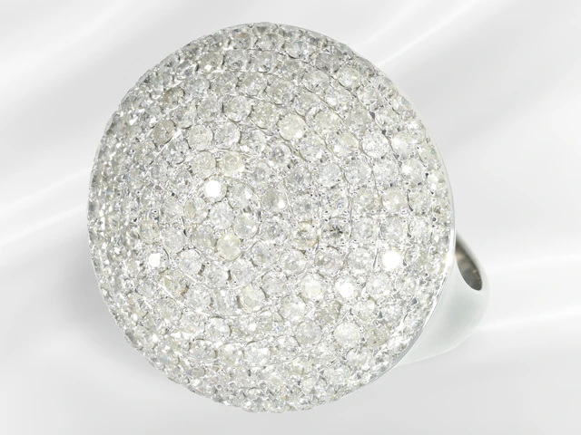 Ring: a white gold brilliant-cut diamond cocktail ring in as good