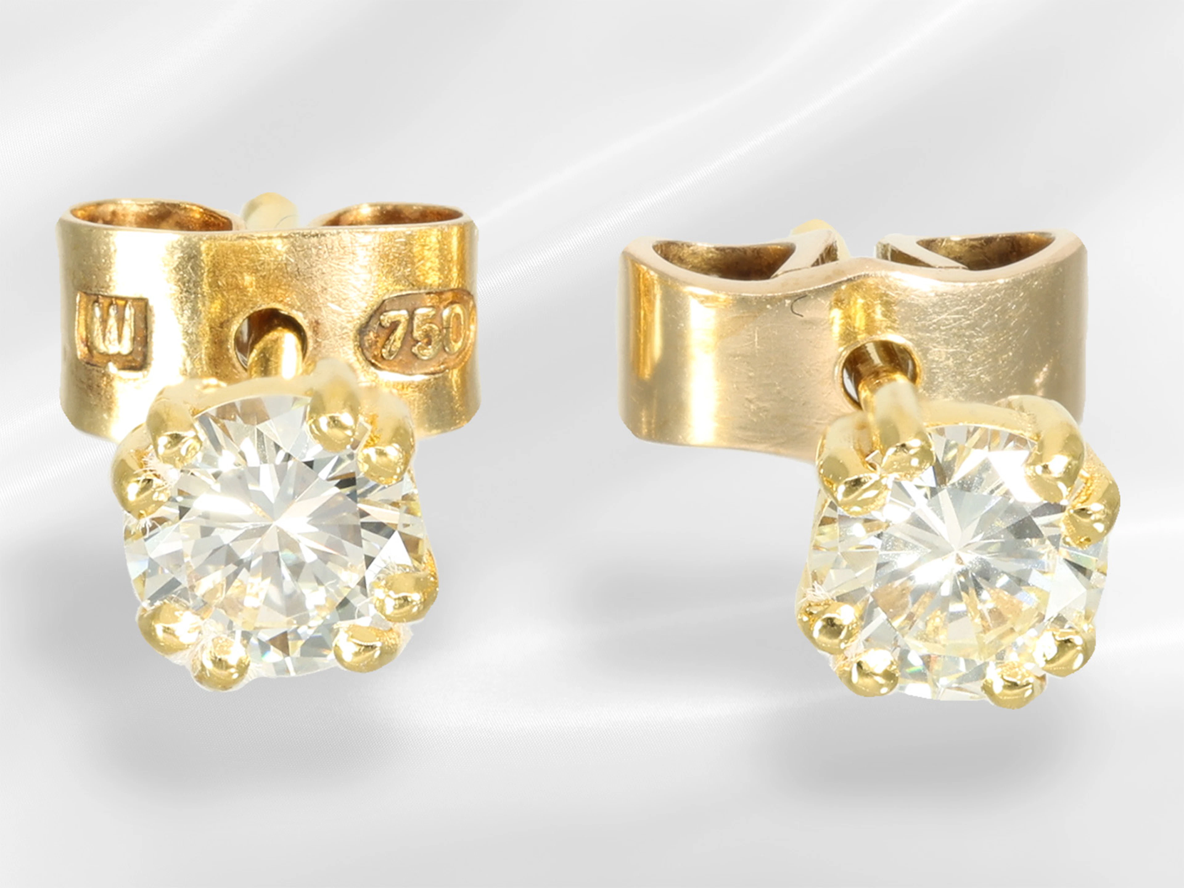 Earrings: Solitaire brilliant-cut diamond stud earrings, ca. 0.66 ct
