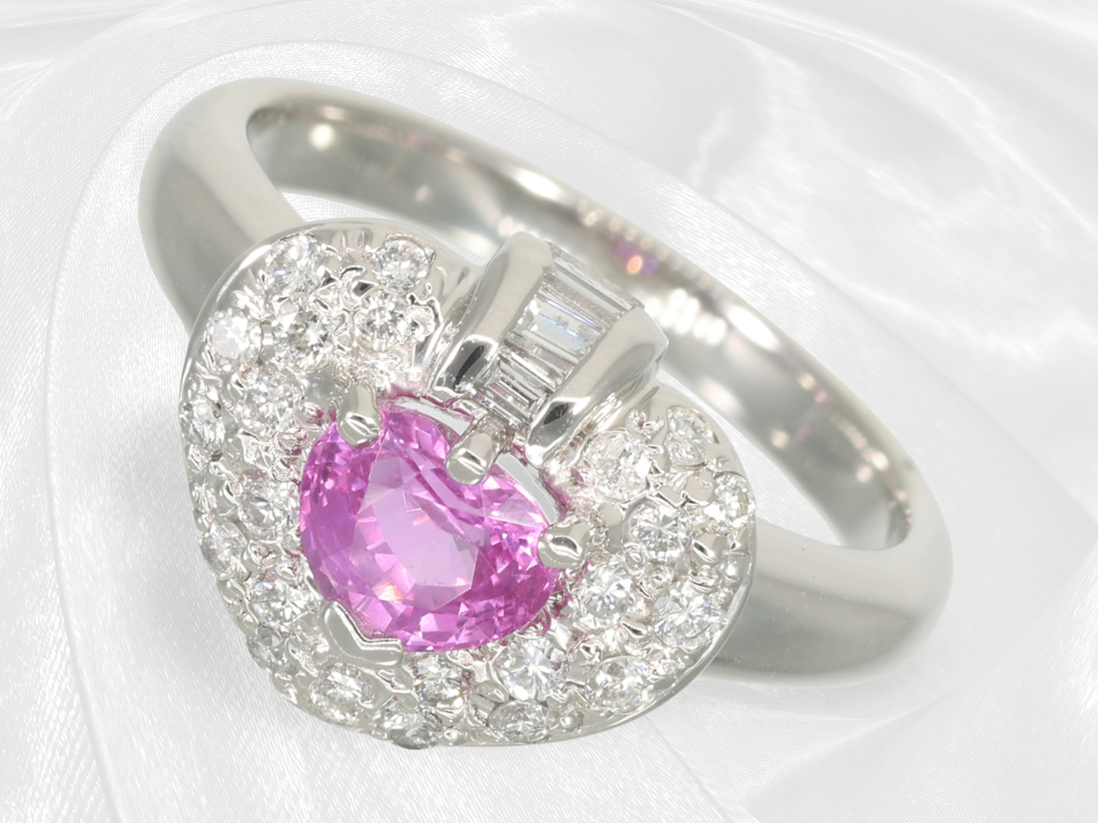 Ring: Platinum heart-shaped ring, featuring a fine natural pink sapphire