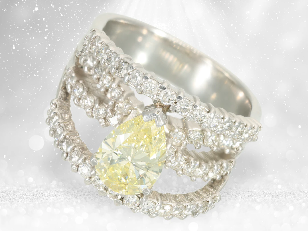 Ring: modern platinum designer ring with a large fancy yellow diamond