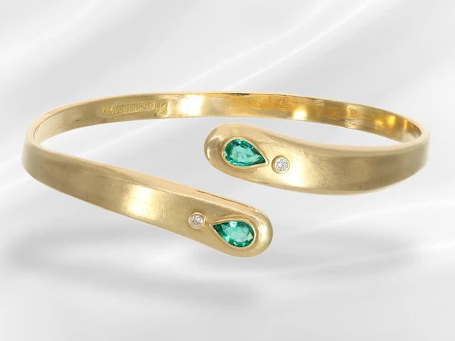 Bangle: open, handcrafted designer bangle in 18K gold with emeralds