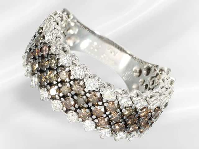 Ring: wide goldsmith's ring by Wempe, featuring fancy brown and white