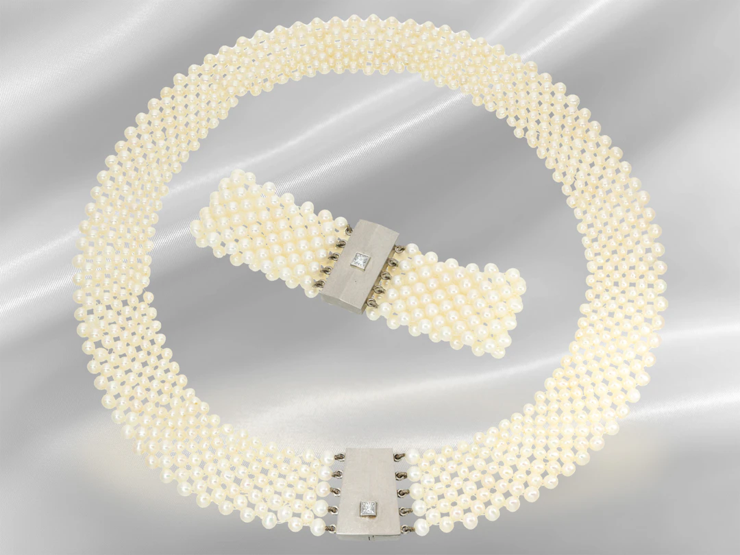 Unique, multi-strand pearl necklace with a modern diamond and platinum