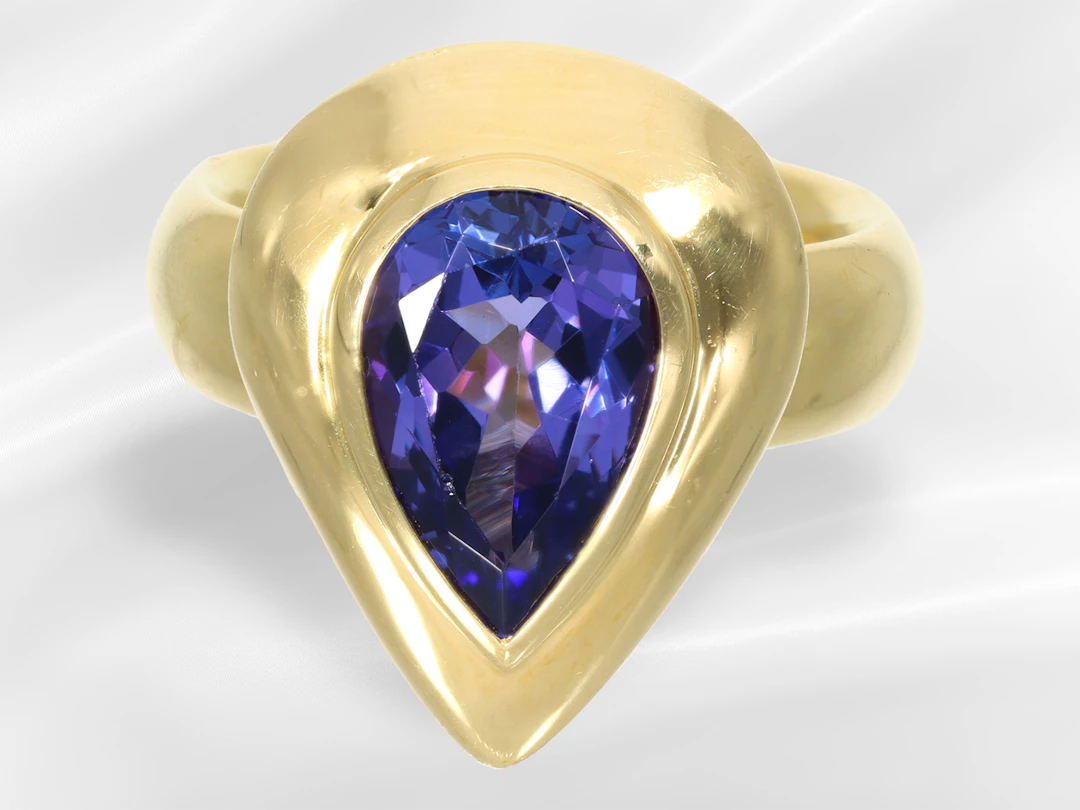 Ring: solid goldsmith's ring featuring a beautiful teardrop-shaped