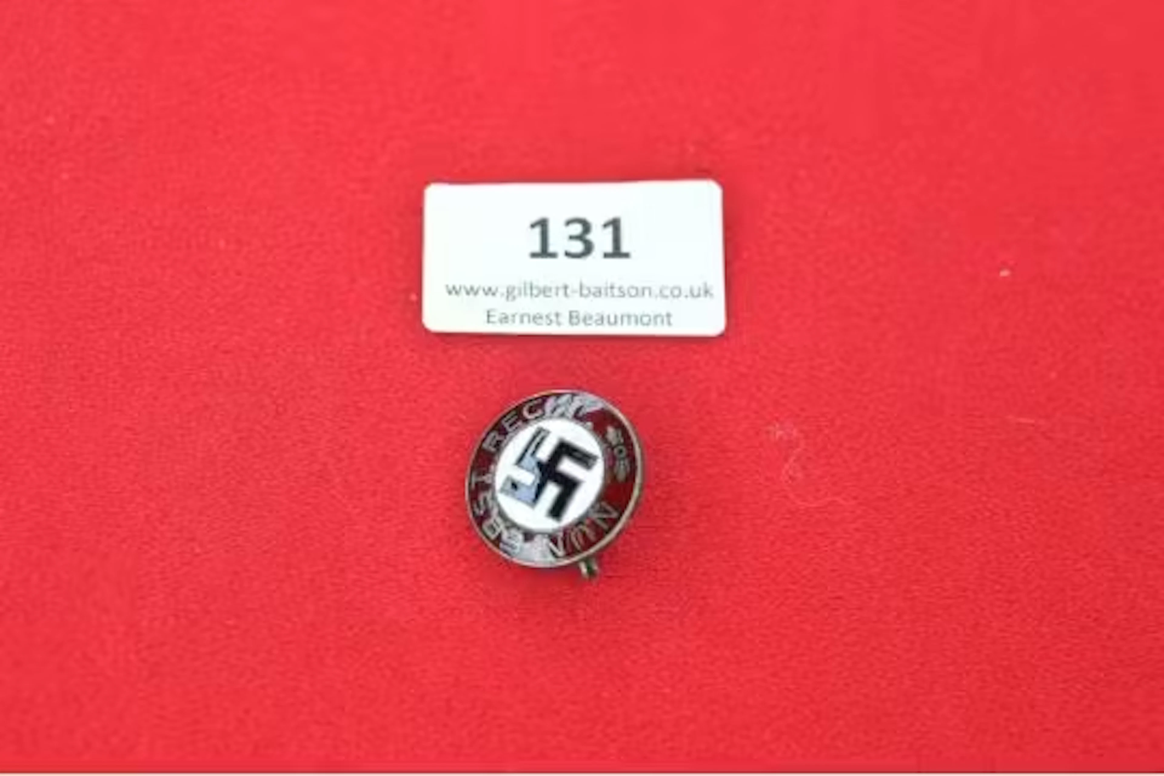 An NSDAP Membership Badge, small circular alloy and enamel example