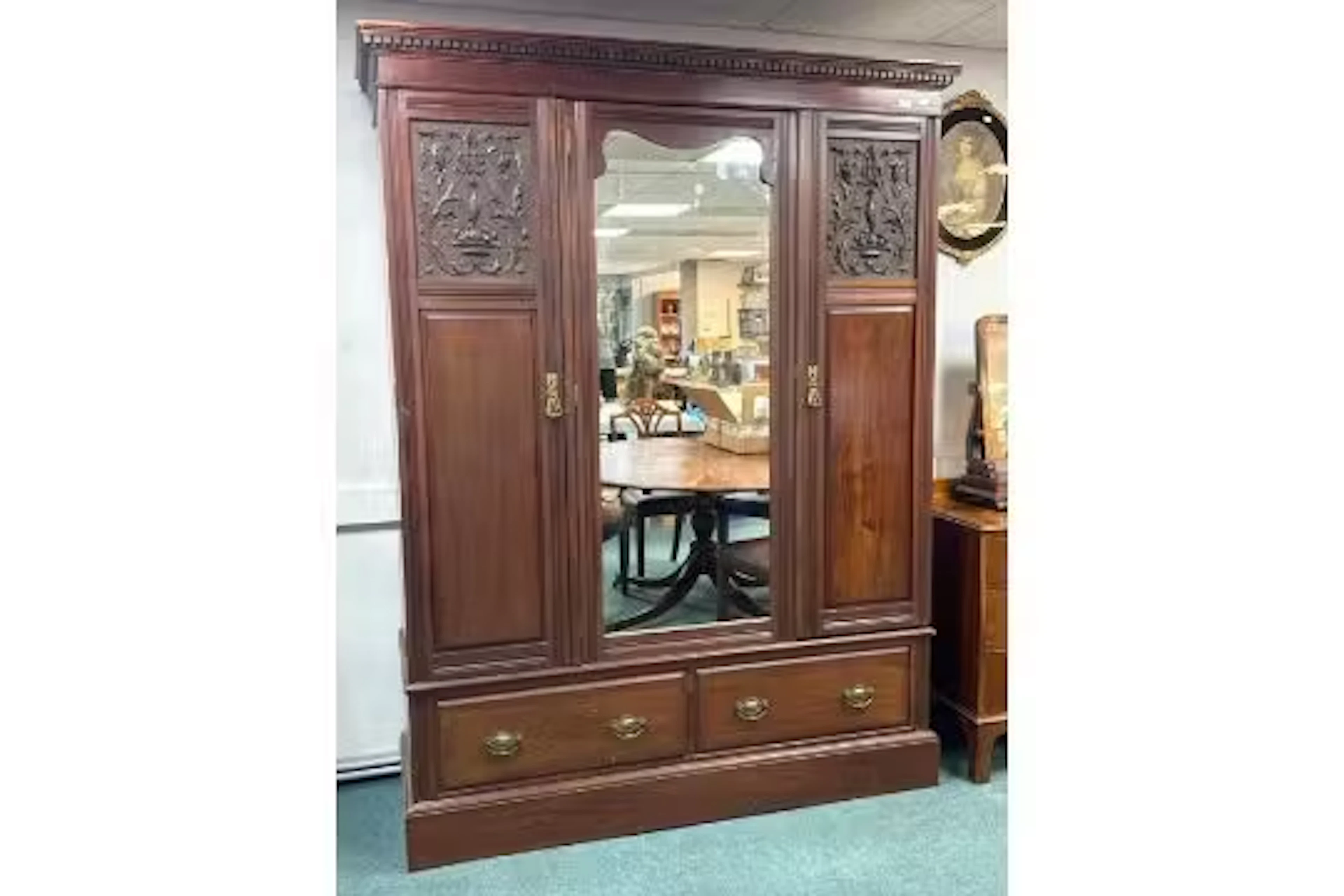 Edwardian Wooden Armoire with Central Mirror, featuring carved panels