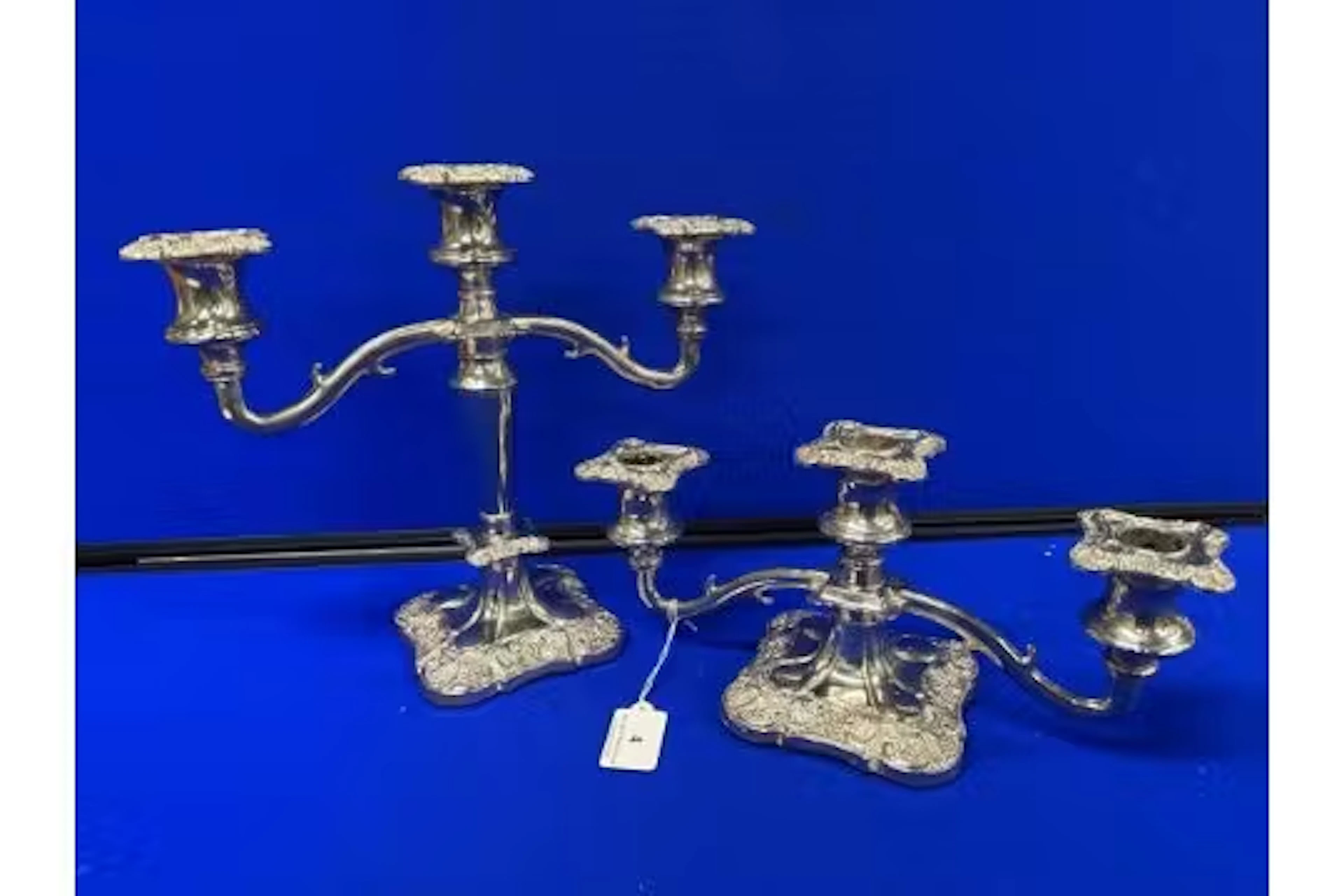 A pair of matching silver plated candelabras