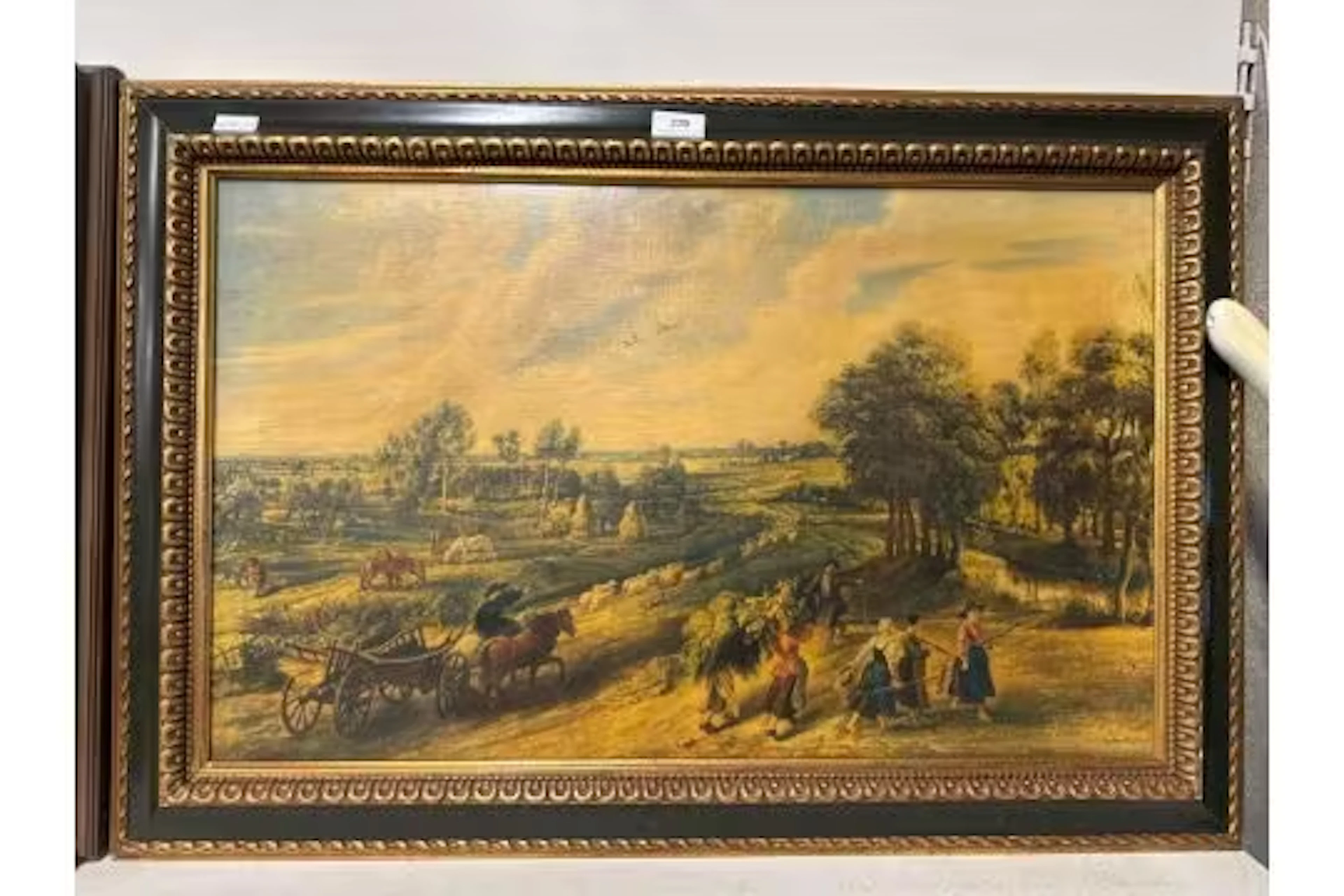 Gilt framed painted print on canvas of a countryside scene