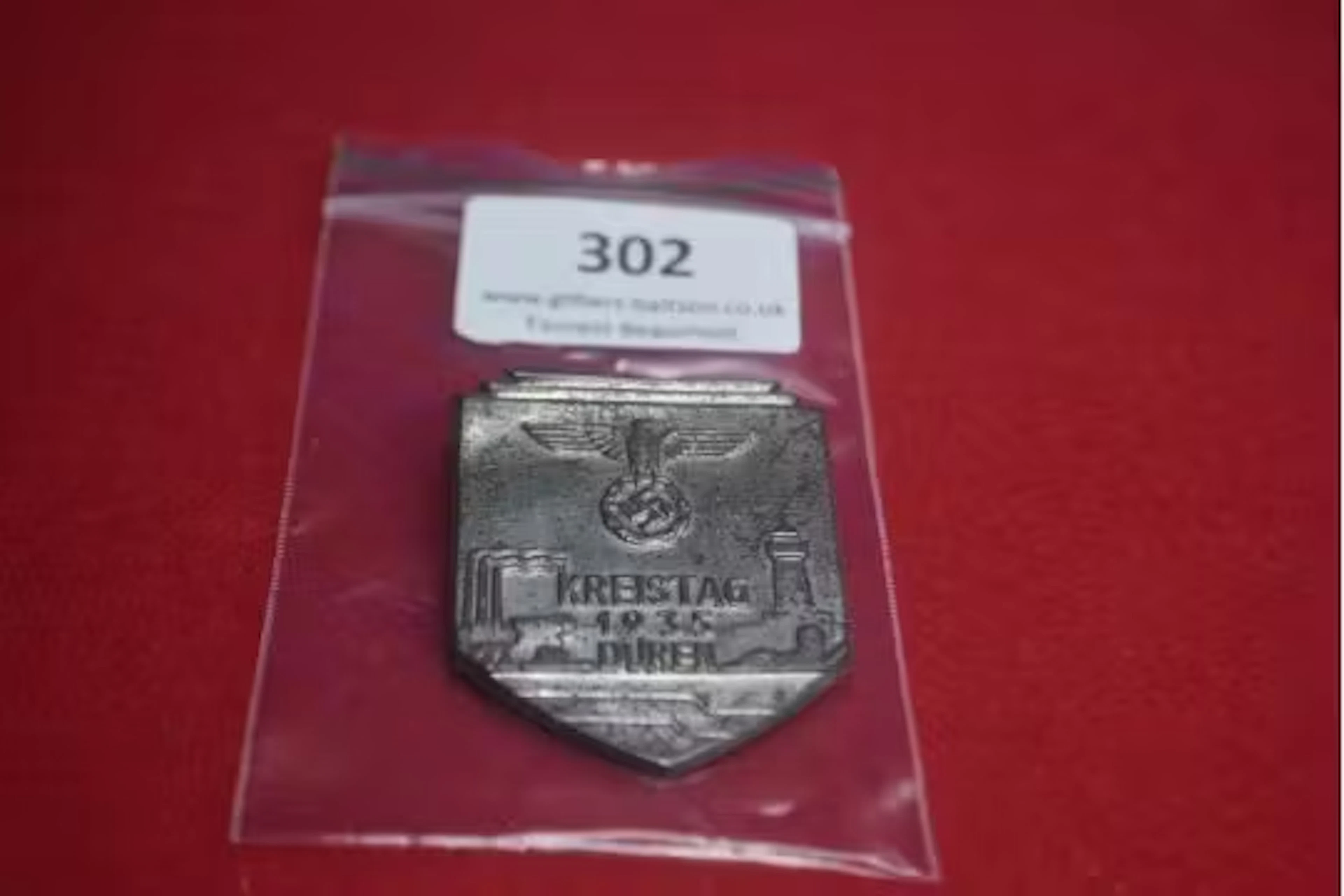 Pressed Tin Commemorative Badge “Kreistag 1935 Düren” – A shield-shaped