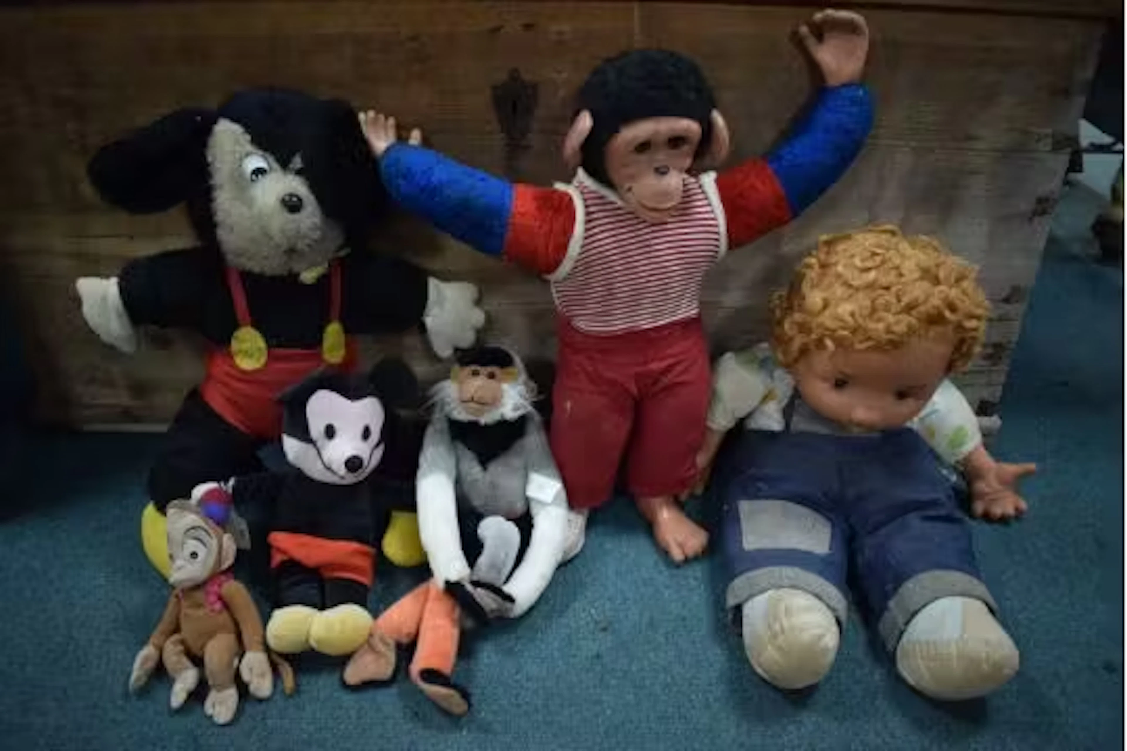 Vintage Soft Toys Including Monkeys, Mickey Mouse, and a Doll