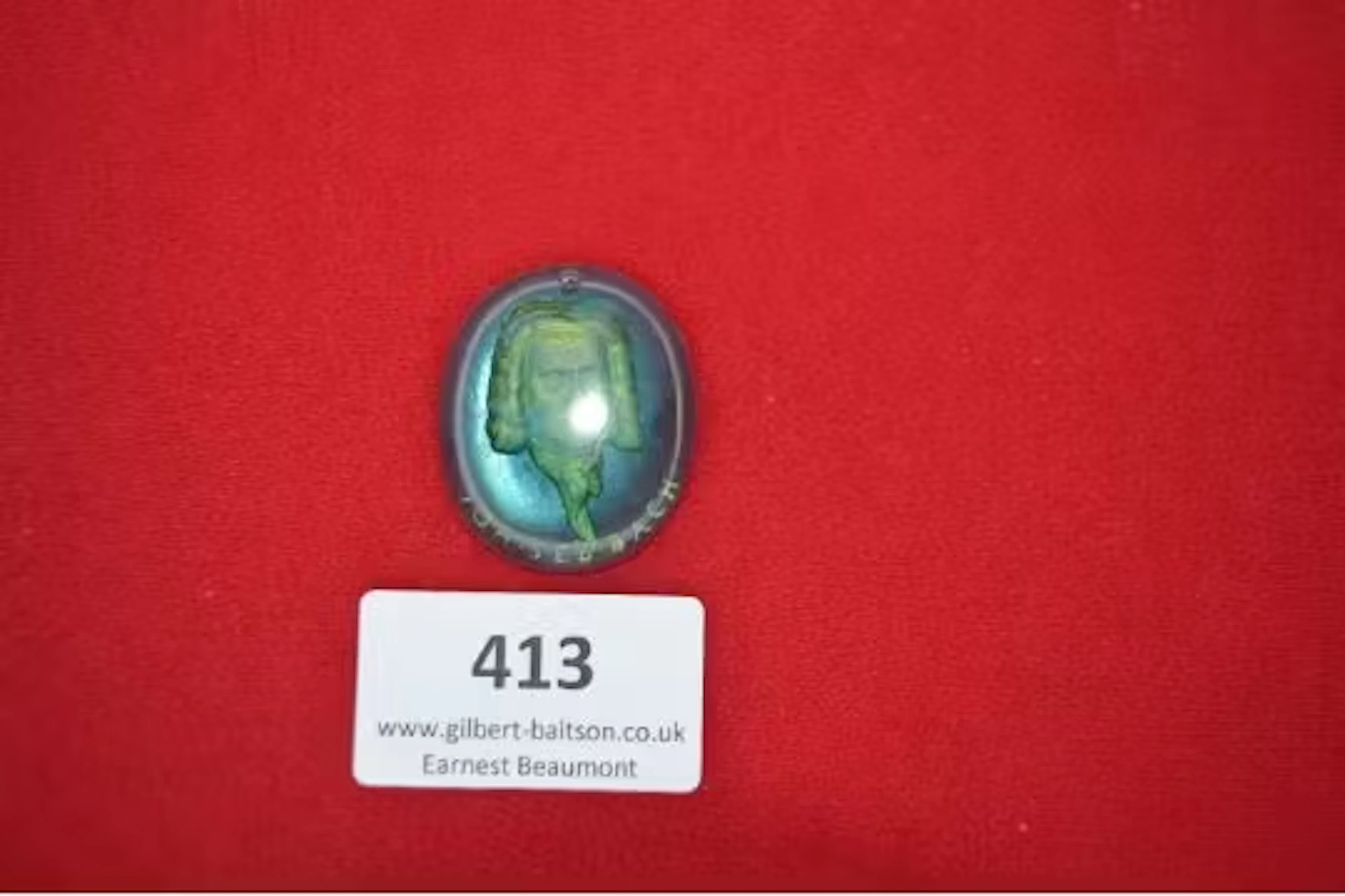 An oval glass pendant with gilt bust portrait of Johann Sebastian
