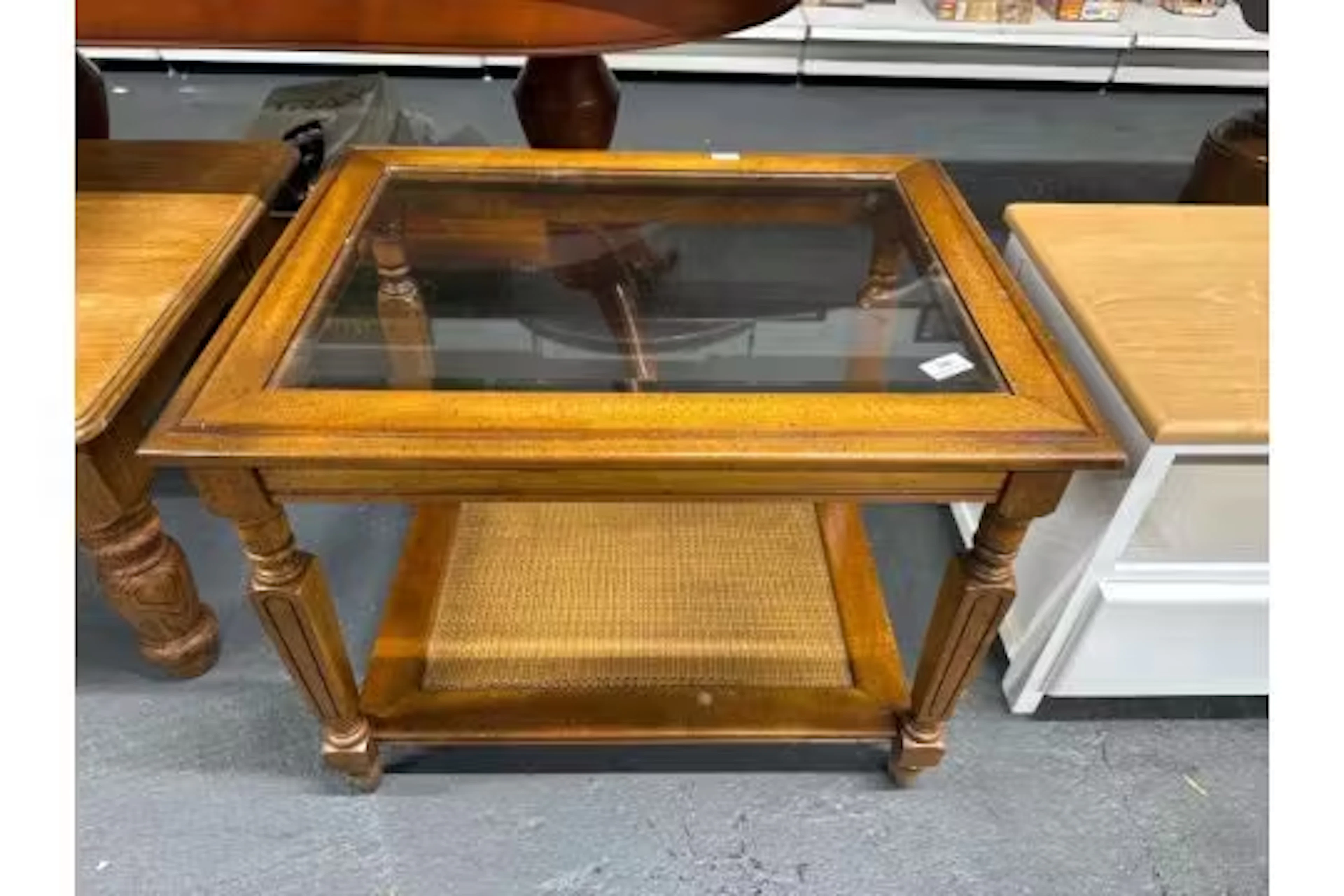 Vintage side table with glass top and cane lower shelf