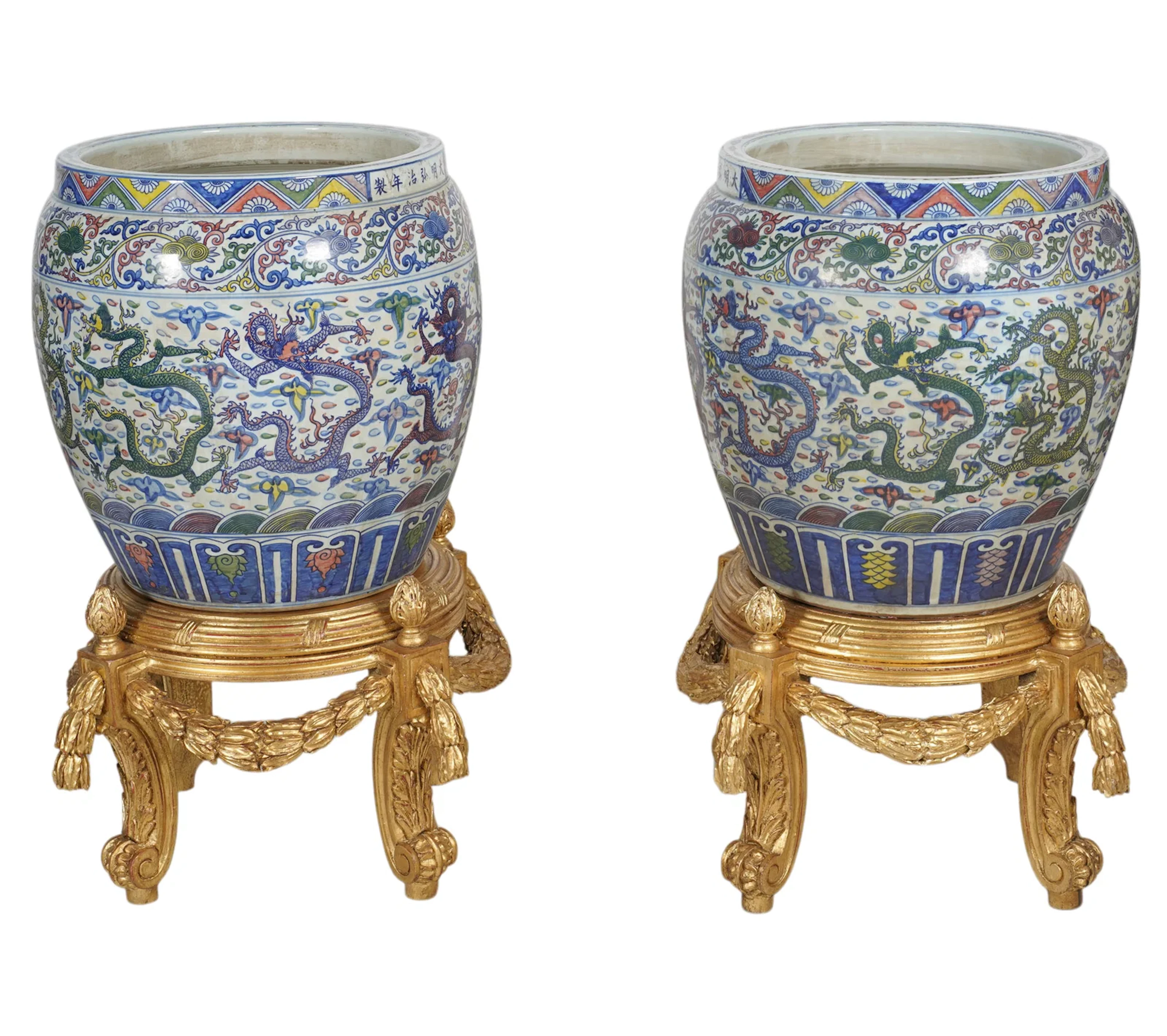 A Pair of Chinese Porcelain Planters on Wood Bases