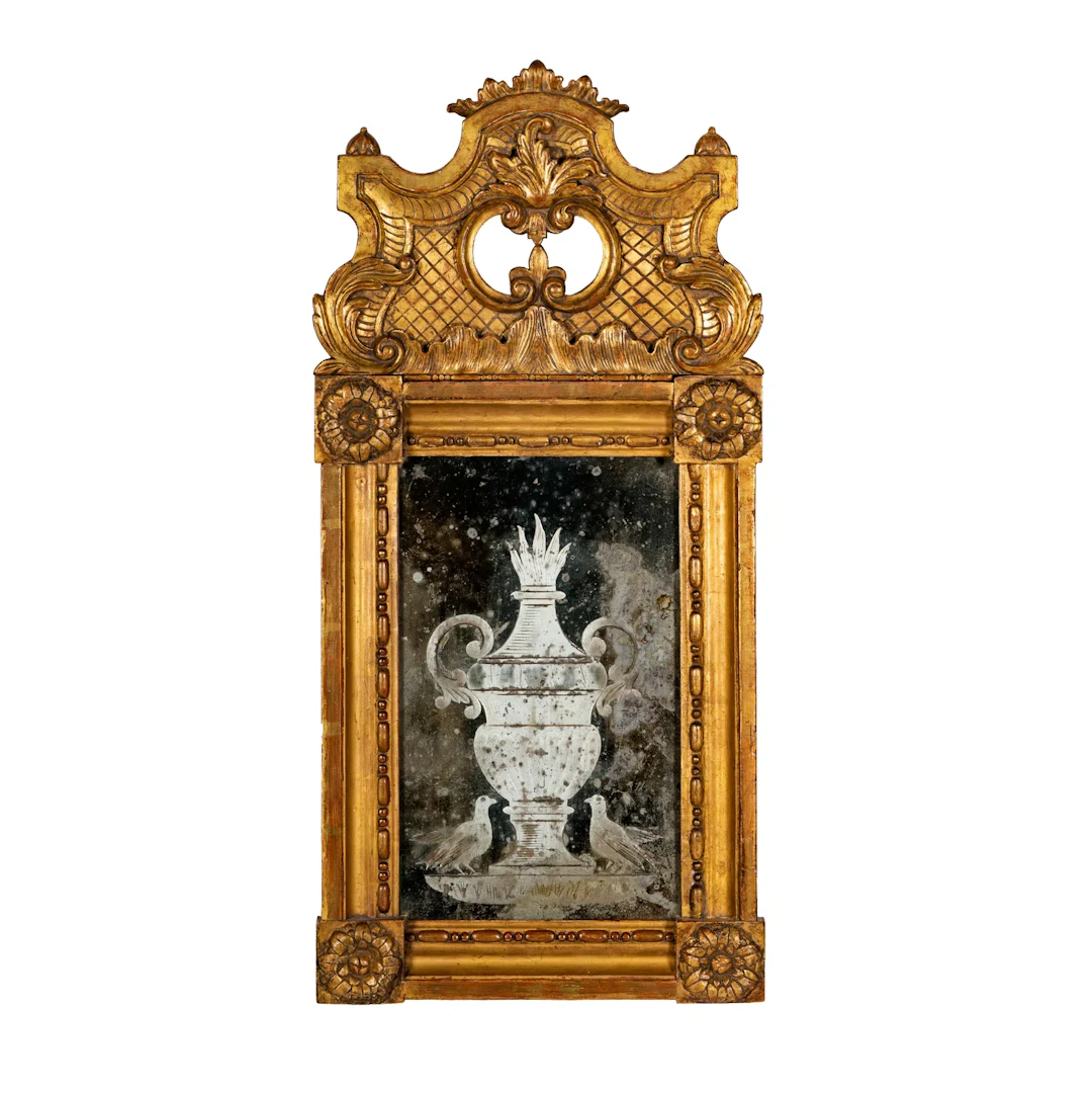 An Italian Baroque Style Giltwood and Etched Glass Mirror
