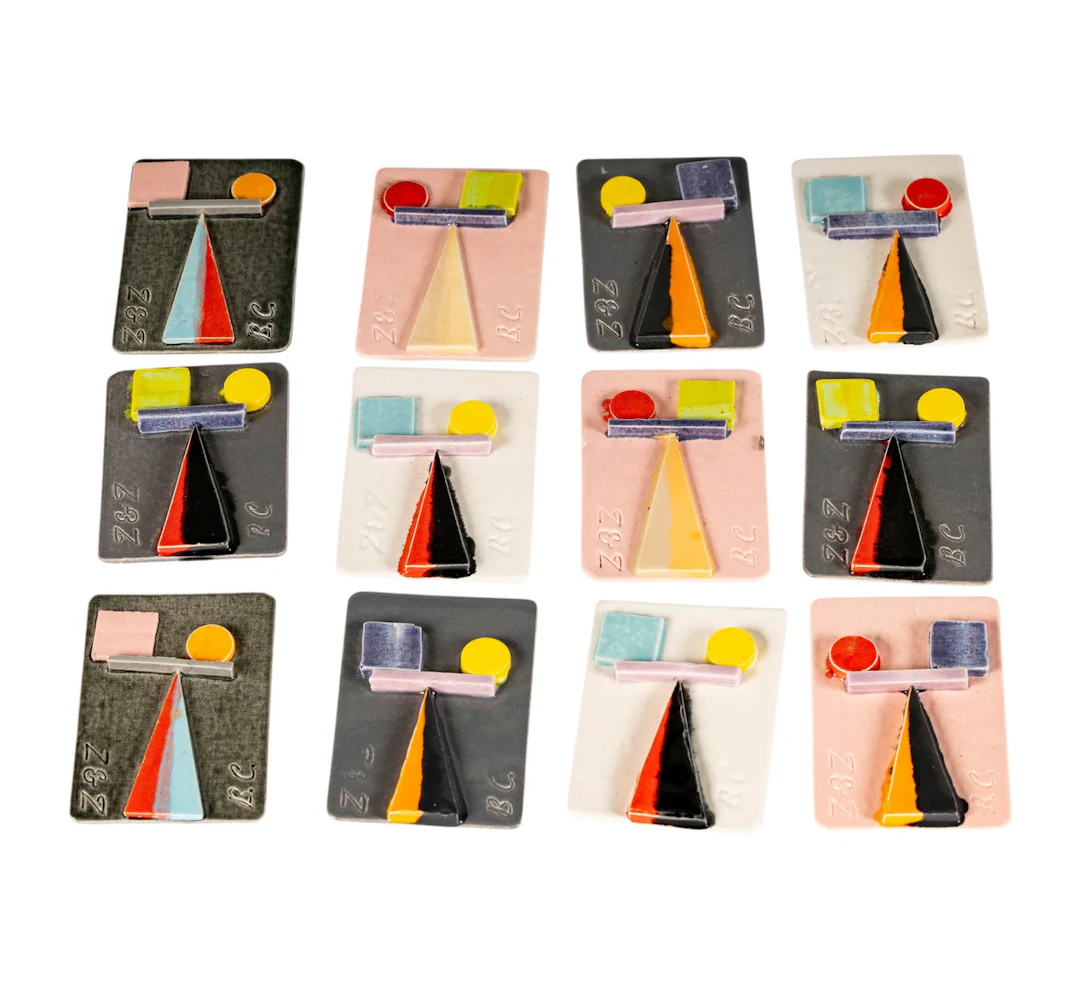 A Group of Twelve Pins